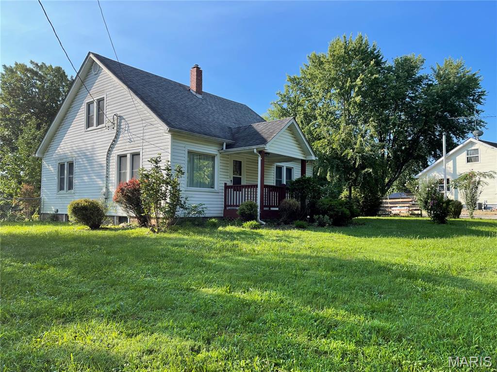 Come view this lovely 3 Bedroom Home with a detached 1 car Garage situated on nearly an acre of land complete with a fenced in Backyard!  Take note of the beautiful wood floors in all the bedrooms, dining room and living room.  Lots of beautiful plants to admire from your porch or backyard patio!  This home is located on a corner lot for convenient access to your fenced backyard.  FYI: the bathtub has recently been refinished.  Seller has never occupied property and is selling AS IS - WHERE IS.