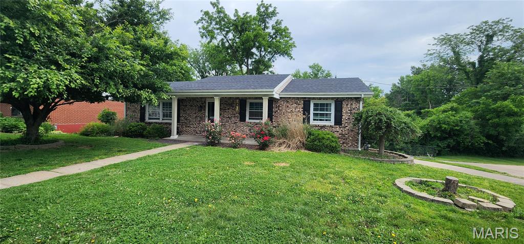 This solid brick ranch offers the perfect blend of comfort, space, and functionality! Featuring 3 bedrooms and 2.5 bathrooms, this well-maintained home includes a full finished basement providing additional living and entertaining space with a wet bar. The tuck-under 2-car garage offers convenience and extra storage. Inside, the kitchen features stainless steel appliances, quartz countertops, and a functional layout designed for everyday living. The roof was replaced in 2022, offering added peace of mind for the next owner. Step outside to enjoy the backyard complete with a black chain link fence, ideal for pets, play, or relaxing outdoors. This home combines classic charm with modern updates and plenty of room to spread out!