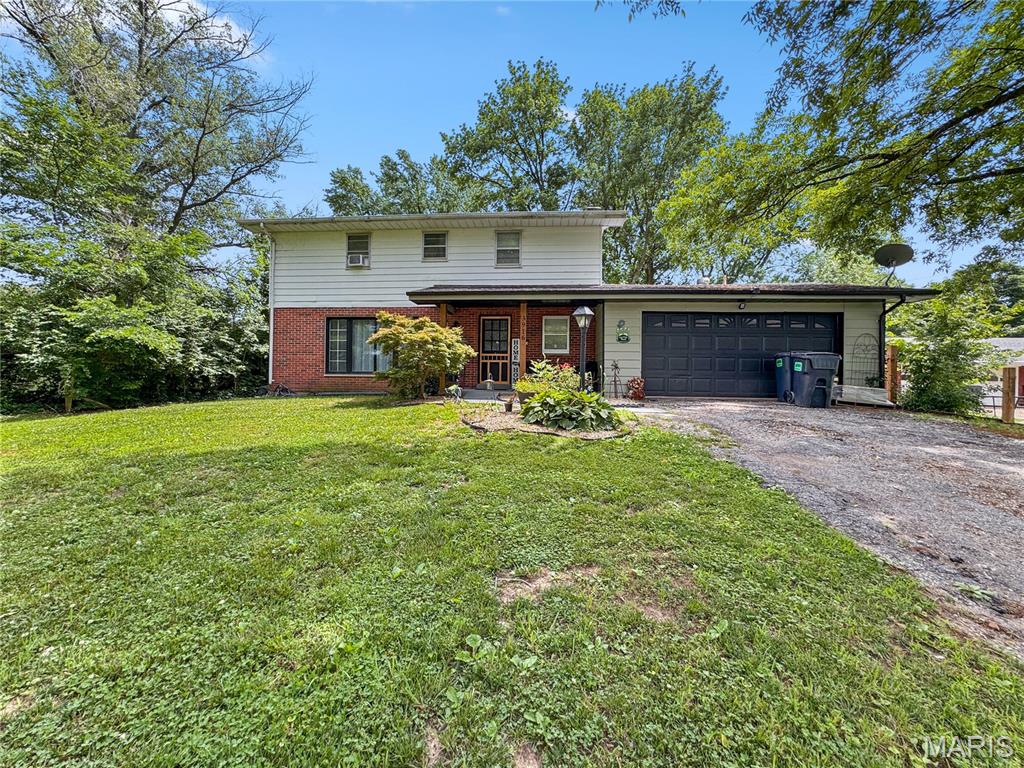 This spacious 5-bed, 3-bath home sits on nearly 1.4 fully acres, offering plenty of room for everyone. A charming front porch with a spring-close screen door sets the tone, reminiscent of simpler days. Step into the formal foyer with staircase to the second level and convenient access to the first of three full bathrooms. The main level features LVP flooring and an open-concept layout, including a generous living room with space for movie nights, a wall of windows that fill the room with natural light, and the perfect backdrop for holiday decor. The living room flows into the large kitchen suite, complete with abundant cabinetry, butcher-block counters, double oven, cooktop, open display shelving, and a spacious prep area. The central dining space easily accommodates an oversized farm table, and the adjoining hearth room—with its warm, inviting fireplace—creates the ideal setting for after-dinner stories or game nights. A large mudroom behind the hearth room provides ample space for laundry, storage, and outdoor gear. Upstairs, all five bedrooms are conveniently located on the same level, including a primary suite with private full bath and an additional hall bath with tub/shower combo. When it’s time to head outdoors, step from the dining room onto the “party porch,” featuring rustic wood beams and metal wainscot—perfect for gatherings, watching the game, or enjoying backyard views. The enormous, flat, fully fenced backyard includes mature trees, a garden shed, a firepit area, and endless possibilities with nearly 1.4 acres of usable space. This property offers room to live, grow, and enjoy the outdoors in every season.  2 Car attached garage and additional parking. 2023 improvements including flooring, paint and trim.  2024 improvements include light fixtures, garage door opening and back yard landscaping.  2025 improvements include kitchen remodel, hall bath, main bath, covered patio, new front porch 10" pillars, some exterior painting. 2026 improvements as well.  Radiant in floor heat for economical uniform warmth. 100 amp underground service. Roof is approximately 10 years old. Water heater 2025. Full unfinished basement for your future creative endeavors.  Convenient access to Frank Scott Parkway.