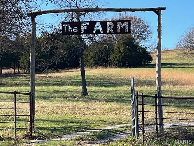 Welcome to the Farm!  Just a few minutes south of Meta in Maries county, you will find this sprawling 188 acre ranch, complete with a modern Gastineau custom log cabin & several outbuildings.  The acreage consists of approximately 100 acres of open pasture currently running 40 cow-calf pairs.  The ridge sits very high & boast an awesome panoramic view of the country side, viewing both Osage & Maries counties.  It includes a half-acre stocked lake, a covered pavilion, & numerous trails.   The 2 story cabin includes approximately 3400 sq ft, has 4 bedrooms (one non-conforming) & 4 baths, 2 laundry rooms, geothermal heating, solar panels, as well as a generac generator.   The inside boast pine wood from head to toe, exposed beams, 3  fireplaces, & 2 large walk-in showers.  Outside includes a breezeway linking you to the 2-car garage, with a deck or sunporch to overlook the in-ground pool & scenic countryside.