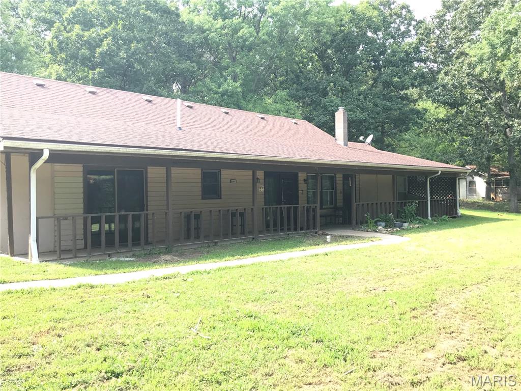 Tucked away on 2.2 acres of secluded, wooded bliss, this charming 3-bedroom, 2-bath home offers the perfect blend of comfort, privacy, and country living. Enjoy peaceful afternoons from the large covered porch overlooking your private surroundings.

The property features a large, established koi pond, chicken coop, ample storage, and plenty of space to enjoy the outdoors. Inside, you’ll find beautiful wood cabinetry and a spacious, open-concept kitchen, dining, and living area that creates a warm and inviting gathering space.

Recent updates include a new water heater and new pressure tank. The upper level offers exciting possibilities and could easily be finished into two additional bedrooms, a large living area, home office, or whatever best fits your needs.

If you’re looking for privacy, room to breathe, and a home with character and potential, this wooded retreat is a must-see!