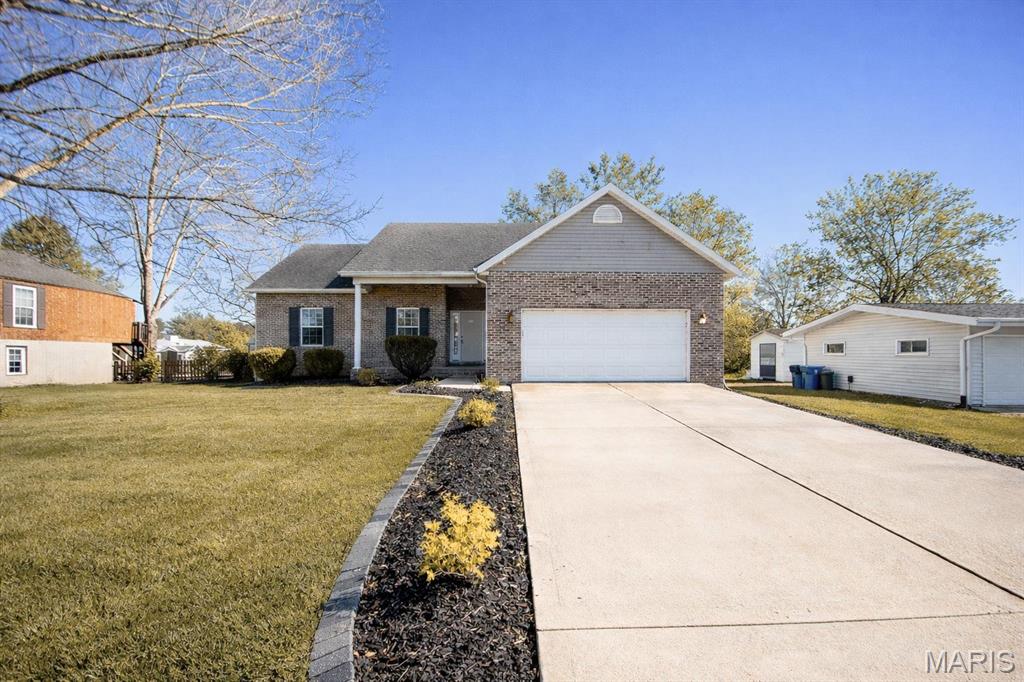 Welcome to this 4-bedroom, 3-bath home in the desirable Holiday Shores community. Designed with space for everyday living and entertaining, the main level offers an open floor plan connecting the living, dining, and kitchen areas with a custom-tiled floor. The private master suite provides a comfortable retreat with its own bath.

The finished lower level features a spacious family room and a large built-in bar, making it a great space for gatherings or relaxing evenings. Step outside to an expansive lighted deck that overlooks a fenced backyard, offering plenty of room to enjoy the outdoors.

With lake access and community recreation, this home offers space, comfort, and the benefits of lakeside living. Buyer or buyer’s agent to verify MLS information.