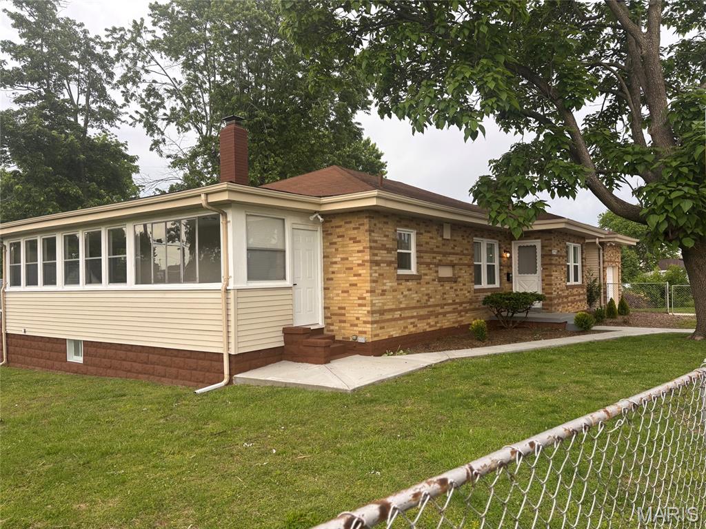 Don't miss the opportunity to view this beautifully updated brick home.   FULLY FENCED DOUBLE LOT IS PERFECT FOR YOUR KIDS  OR DOGS TO PLAY.   All new windows , doors and flours, a large living room with wood burning fireplace separate dining room then completely remodeled kitchen with new granite top kitchen cabinets new bathroom and three bedrooms. The layout   includes a generous   sun room ideal for relaxing or entertaining. Full clean walk out basement with laundry room. Additional space in between the living room and garage ready to use for storage!!  ready to move in!!  Occupancy inspection has been completed .  Very nice car garage with a  new driveway and a lot of parking space in front of the house .Close to public  transportation restaurants and shopping !!
