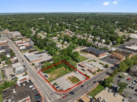 Highly visible .87 Acre Corner Commercial Lot in the heart of downtown Overland at the busy intersection of Woodson Rd. and Lackland Rd. Perfect for a QSR or sit down restaurant plus many other uses. Composed of 2 parcels sold together as one. 
2407 Woodson Rd- Tax ID 15L-64-0191
9407 Lackland Rd- Tax ID 15L-64-0201 Location: Corner Location