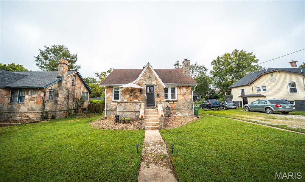 Welcome home to this charming 3-bedroom, 2-bathroom property nestled in the heart of Rolla, where timeless character meets valuable updates and everyday convenience. With inviting living spaces and a central location close to shopping, dining, schools, and local amenities, this home offers plenty to appreciate inside and out. Step inside and enjoy the warmth and personality found throughout the home, complemented by original hardwood flooring that provides a stylish and durable foundation for everyday living. Over the past five years, the windows throughout the home have been updated, along with the electrical and plumbing lines located in the basement, giving future owners added peace of mind. The basement heating unit was also updated last year. The full unfinished basement offers an abundance of possibilities and includes a sump pump for added functionality. Whether you need extra storage, a workshop, home gym, hobby area, or envision finishing additional living space in the future, there’s plenty of room to make it work for your lifestyle. If you’re searching for a Rolla home filled with character, practical updates, and plenty of potential to make it your own, this property deserves a closer look. Schedule your private showing today and discover everything this charming home has to offer!