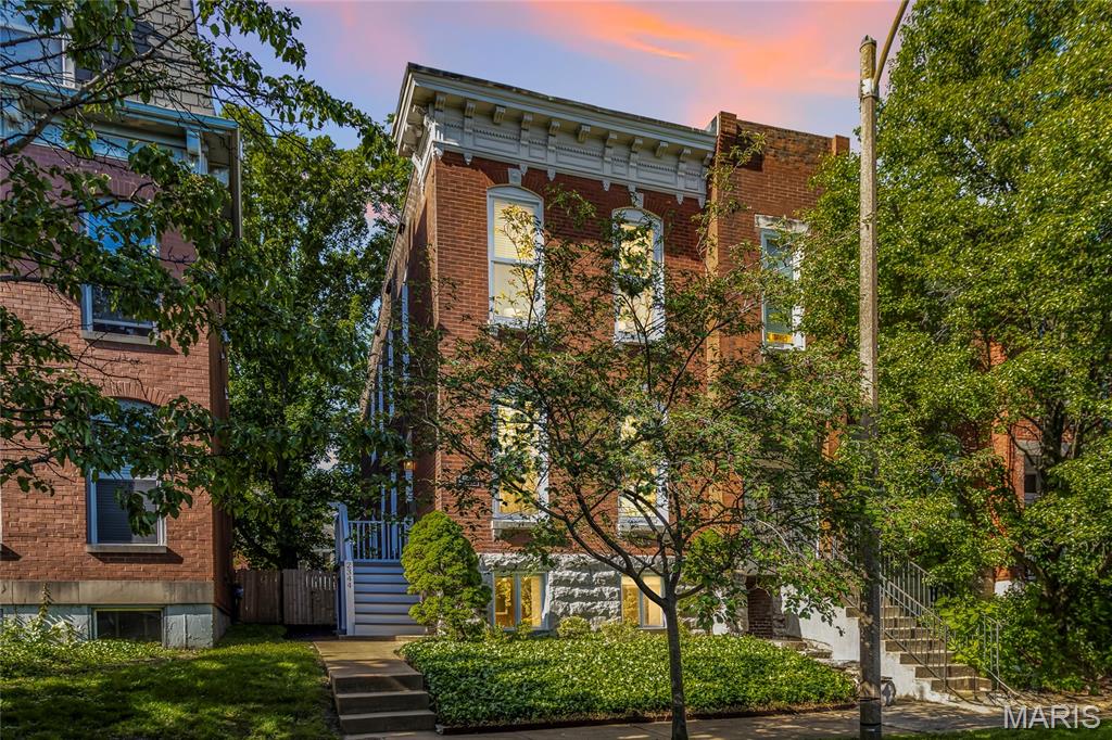 Iconic Lafayette Square brick residence (1886) delivering 2,231 total living area, with 1,768 sq ft above grade plus a finished walk-up lower level. Steps to Lafayette Park and the Park Avenue corridor for coffee, dining, and nightlife, this address offers the walkable city lifestyle buyers chase in 63104.

Inside, enjoy tall ceilings, hardwood floors, oversized windows, and decorative fireplaces that highlight the home’s historic character. The main floor flows comfortably from living to dining, paired with a convenient powder room. The eat-in kitchen features 42-inch cabinetry, generous prep space, a breakfast nook, and included appliances.

Upstairs are two private bedroom suites, each with its own full bath, plus second-floor laundry. The finished lower level adds flexible use for a lounge, gym, media room, or office zone, along with storage and direct exterior access.

Outside, a fully fenced yard provides privacy, while the rear parking pad offers true off-street convenience for two vehicles. Quick routes to downtown, Soulard, Benton Park, and major interstates round out the package.