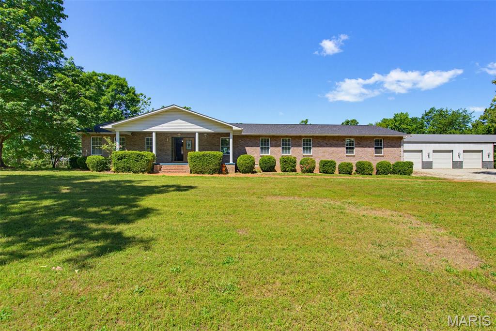 Check out this beautiful home just outside of Doniphan!! This home is one of the nicest single level homes there is and the shop is just as impressive!! The home features 3 large bedrooms with amazing master bath in the bedroom along with a nice open floor plan throughout the house with a nice combined kitchen and living area!! The finished out 40x80 shop (plus large lean to covered area) with HVAC and the oversized attached garage are hard to find all sitting on a beautiful park like 4 acres +/- only minutes to Doniphan and Current River. This home won't last long so schedule your showing today!