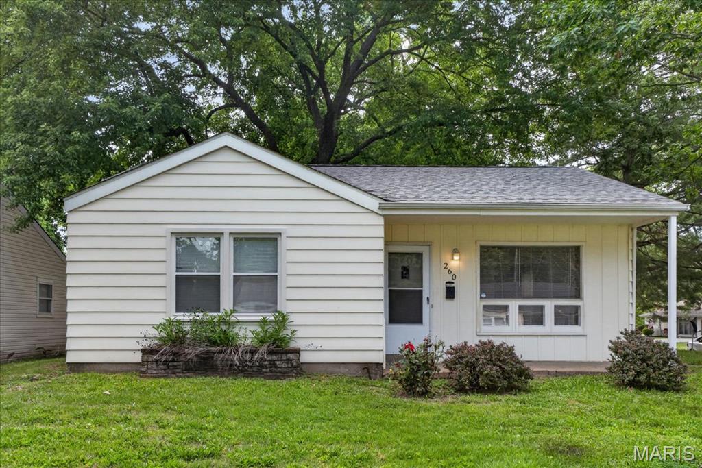 Beautiful two-bedroom bungalow conveniently located close to Highway 270 in Florissant!! Great as a primary residence or investment property.  This home has a spacious front living room with tons of natural light, vinyl hardwood flooring in the living room and carpet in the bedrooms.  The bathroom has some updates. There's a utility room for storage and washer/dryer hookups.   The sizable backyard is completely enclosed with a shred for additional storage.