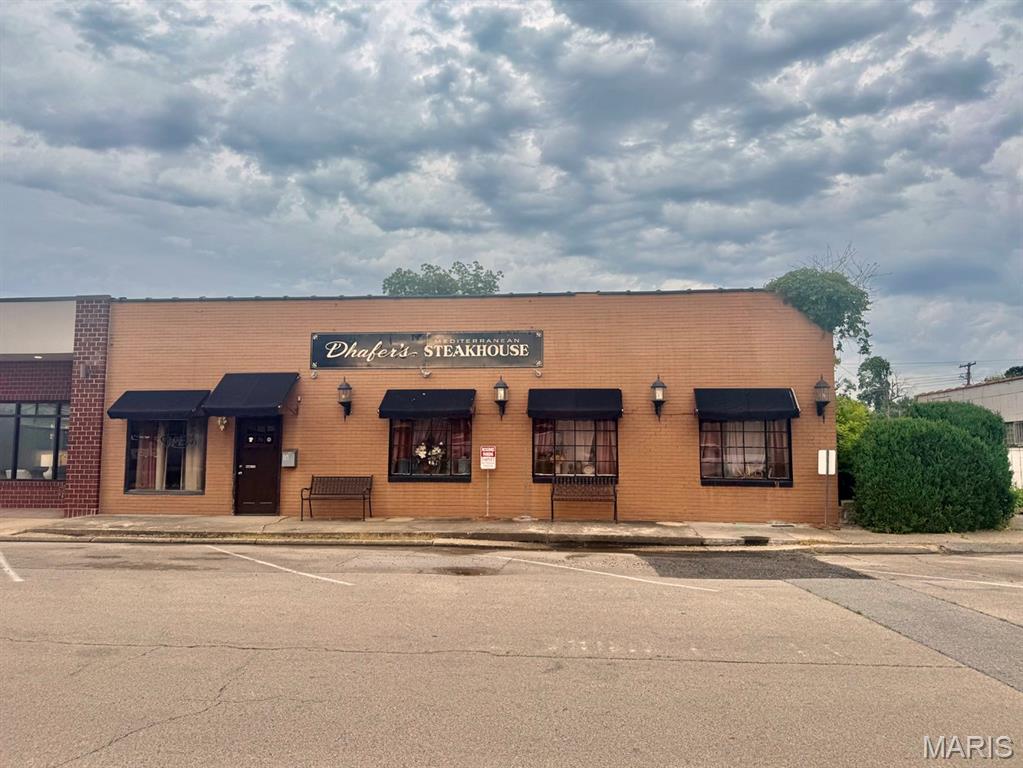 Exceptional downtown commercial opportunity! This approximately 4,000 sq. ft. property has operated successfully as a restaurant for several years and is being offered with an extensive inventory of equipment and furnishings. Included are tables, chairs, linens, a bar area, salad bar station, large walk-in freezer, fully equipped commercial kitchen with stainless steel appliances, ice maker, washer and dryer, and much more.  Located in a desirable downtown shopping and business district, this versatile space offers endless possibilities. Continue operating as a restaurant or transform the property into a boutique, retail store, event venue, office space, or another business venture. The flexible floor plan can be divided to accommodate multiple uses or tenants.