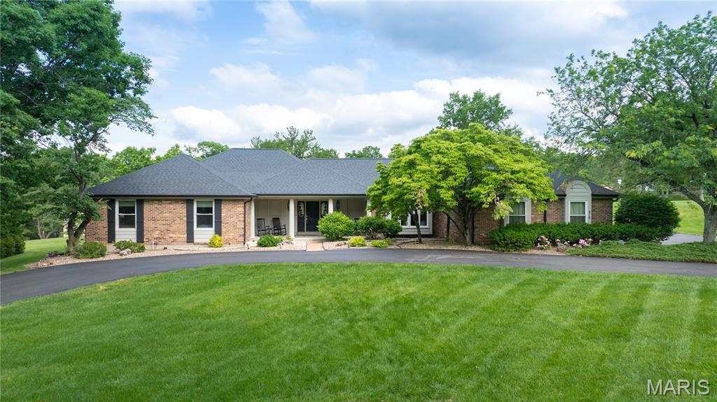 Nestled on over an acre in sought-after Forest Hills Club Estates, this beautifully maintained 4-bedroom ranch offers the perfect blend of space, comfort, and entertaining potential. The expansive flat backyard provides endless possibilities for outdoor living, play, or future additions. Inside, the spacious Great Room flows seamlessly into a dedicated bar room, creating an inviting layout ideal for hosting gatherings, game days, or relaxing evenings at home. The finished lower level adds over 1700 additional square feet of versatile living space and includes a full bath, making it perfect for a recreation room, home gym, or media area. With generous living spaces, a desirable single-level floor plan, and a premier neighborhood setting, this home delivers both everyday comfort and exceptional entertaining appeal.