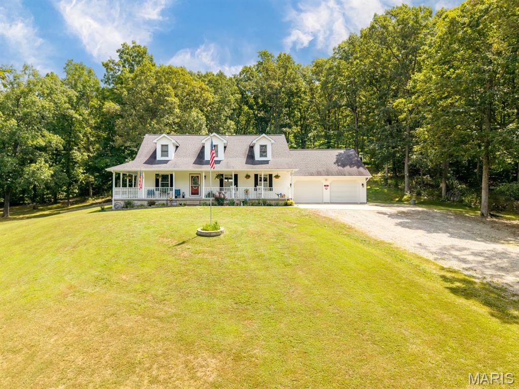 THESE MOTIVATED SELLERS WANT YOU TO START THE NEW YEAR IN YOUR NEW HOME!!!! Schedule your private showing today and bring them your reasonable offers. 
Make your dreams reality with this secluded 10 acre property hosting a stunning 1.5 story home, pool, 30x40 shop, 14x30 equipment shed, pool shed,wet weather creek, and cabin in the woods. Nestled at the end of a private road, serenity greets you as you enter the gate. Step inside your haven of peace, from the covered front wrap porch, entering the open living space of the main level. Spacious kitchen with breakfast bar and eat in kitchen; the cathedral height ceiling and calming view through the rear wall of windows looking to the 15x30 pool +woods. Enjoy your pool in privacy on the back patio (Pergola stays) or the oversized deck. Surrounded by woods and at the end of a non-through-street, you'll remain uninterrupted everywhere on the property. Main floor primary suite introduces updates with a walk-in shower and over sized closet. Main floor laundry-designed with function in mind. Washer/dryer stay and fit the cabinets and countertops seamlessly. Additional mn floor 1/2 bath + garage access. Upstairs are 2 more bedrooms with jack-n-jill style bathroom (separate vanities) and walk-in closets. NEW carpet 8/25. Lower level has an office, possible kitchenette and 4th sleeping, unfinished storage area and living room. Walk out access.  Bring your ATV's and plug in your RV at the 30x40 shop with it's own electric service+covered porch with ceiling fans. Additional outbuilding storage, a garden area with rain catchment systems and trails cut to a little cabin in the woods.