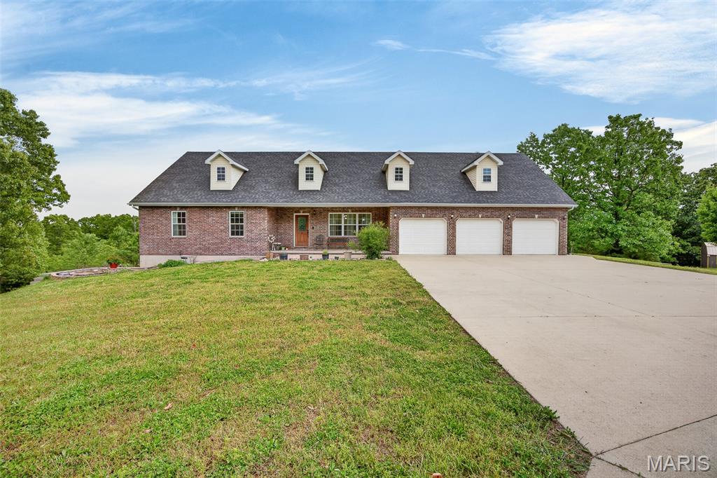 Custom Built Home in Northern Heights. 4/5 Bedroom Custom Home with 3 Full Baths(2 Jetted Tubs) and 2 Half Baths. Enter onto the Large Covered Front Porch, Great Room has Vaulted Ceilings and Lots of Natural Lighting. Formal Dining Room and Sunroom have a Dual Fireplace, Gourmet Kitchen with Custom Staggered Cabinets, Island, Pantry and Stainless Appliances. Large Utility Room on Main Floor with Utility Sink, Stackable Washer, & Dryer, and Additional Cabinets. Large Sunroom has lots of windows and Opens onto Deck. Primary Suite has Special Ceilings, Fireplace, Large Walk-in Closet, and Door Opening Onto Deck. Primary Bath has double vanities, jetted tub, Separate Shower and Lots of Cabinets. Powder Room on Main Floor. Finished Lower Level has Family Room/ Recreation Room with another fireplace, and Raised Bar. 3 More Large Bedrooms on Finished Lower Level with Walk-In Closets, another Bath Room with Jetted Tub, and Jack and Jill Bathroom between 2 Bedrooms. Another Half Bath on Lower Level, and Concrete Storm Shelter. Additional Room behind the 3 Car Garage makes a great Office or 5th Bedroom. Massive Deck overlooks above ground pool and over 11 acres of land. Enjoy the Apple Trees, Pear Trees, Plum Trees, Hazelnut Trees, & American Cranberry Bushes, Gooseberry Bushes, Blueberry Bushes & Service Berry Bushes. Total Acreage has been added together as land is noted on 2 adjoining tracts of land.(2 parcels noted on separate tax bills). Great Place to Call Home!