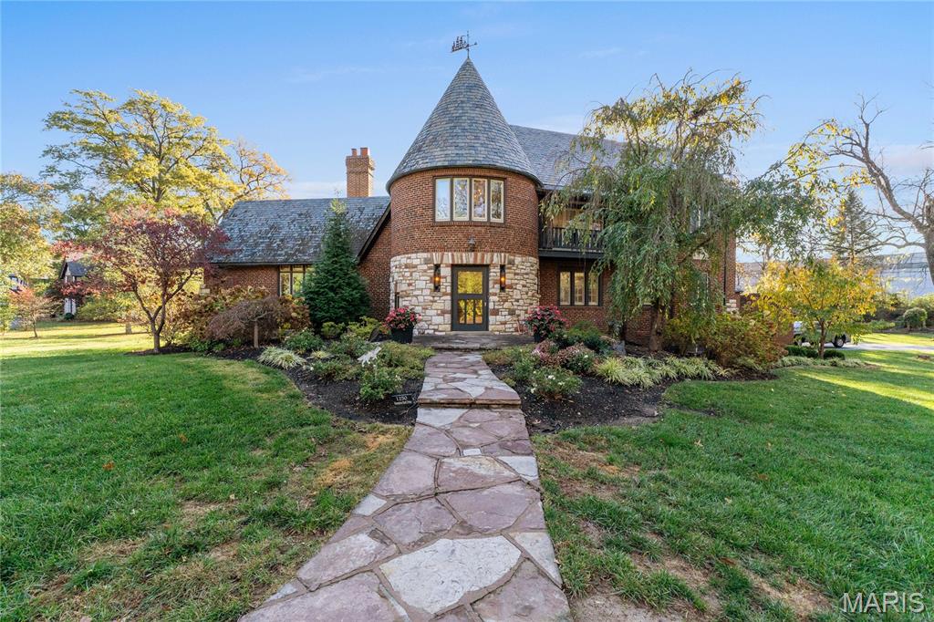Maritz & Young Masterpiece in Hampton Park
Nestled in the heart of Richmond Heights’ beloved Hampton Park neighborhood, this stunning home blends timeless craftsmanship with undeniable charm.
A breathtaking terrazzo staircase, exquisite plaster moldings, and picturesque views set the tone from the moment you enter. The main floor features an expansive living room with a cozy gas fireplace—the true heart of the home—along with a gracious entry hall opening to a covered porch and a large formal dining room just off the kitchen.
Upstairs, you’ll find two inviting bedroom suites with beautifully updated full baths. The third floor offers a private retreat—complete with a bedroom, full bath, and a comfortable sitting room—perfect for guests, a home office, or a creative escape.
Additional highlights include an attached two-car garage, a spacious and lush lot, and a charming red barn that’s ready for updates—imagine the perfect party spot or versatile studio space.
Hampton Park is one of Richmond Heights’ most sought-after neighborhoods, offering convenience, character, and community. Don’t miss this rare opportunity to own a true architectural treasure.
