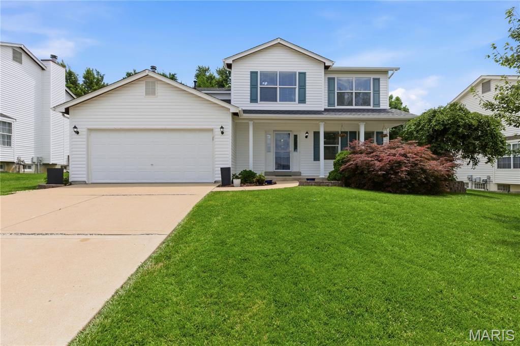 Welcome home to this beautifully updated, move-in-ready two-story offering the perfect blend of space, style, and convenience! Featuring 4 bedrooms, 3 baths, and multiple living areas, this home is designed for both comfortable everyday living and effortless entertaining.

From the moment you arrive, you'll appreciate the impressive curb appeal highlighted by a brand-new architectural shingle roof (2026) and brand-new siding (2026). Recent updates include new luxury vinyl plank flooring (2024), a new back door and frame (2026), a new microwave (2026), and a new water heater (2023). Inside, large windows fill the home with natural light, creating a warm and inviting atmosphere throughout. The versatile floor plan includes a formal living room, separate dining room, and a spacious family room centered around a charming brick wood-burning fireplace.

The bright and inviting kitchen features stainless steel appliances, ample cabinet space, and a sunny breakfast room overlooking the backyard. Upstairs, the spacious primary suite serves as a private retreat with an oversized en suite bath complete with a soaking tub, separate shower, and plenty of room to relax. Three additional generously sized bedrooms provide space for family, guests, or a home office.

The finished lower level offers even more living space with a huge recreation room, wet bar, refrigerator, and abundant storage. Step outside to a large, level, fenced backyard featuring a patio addition and fire pit completed in 2023—perfect for entertaining, outdoor gatherings, pets, or play. A finished garage with built-in shelving adds extra convenience and storage.

Located in the highly desirable Francis Howell School District and just minutes from Highways 364 and 94, this home offers easy access to shopping, dining, parks, and everyday amenities. With its extensive updates, functional floor plan, and fantastic location, this is one you won't want to miss!