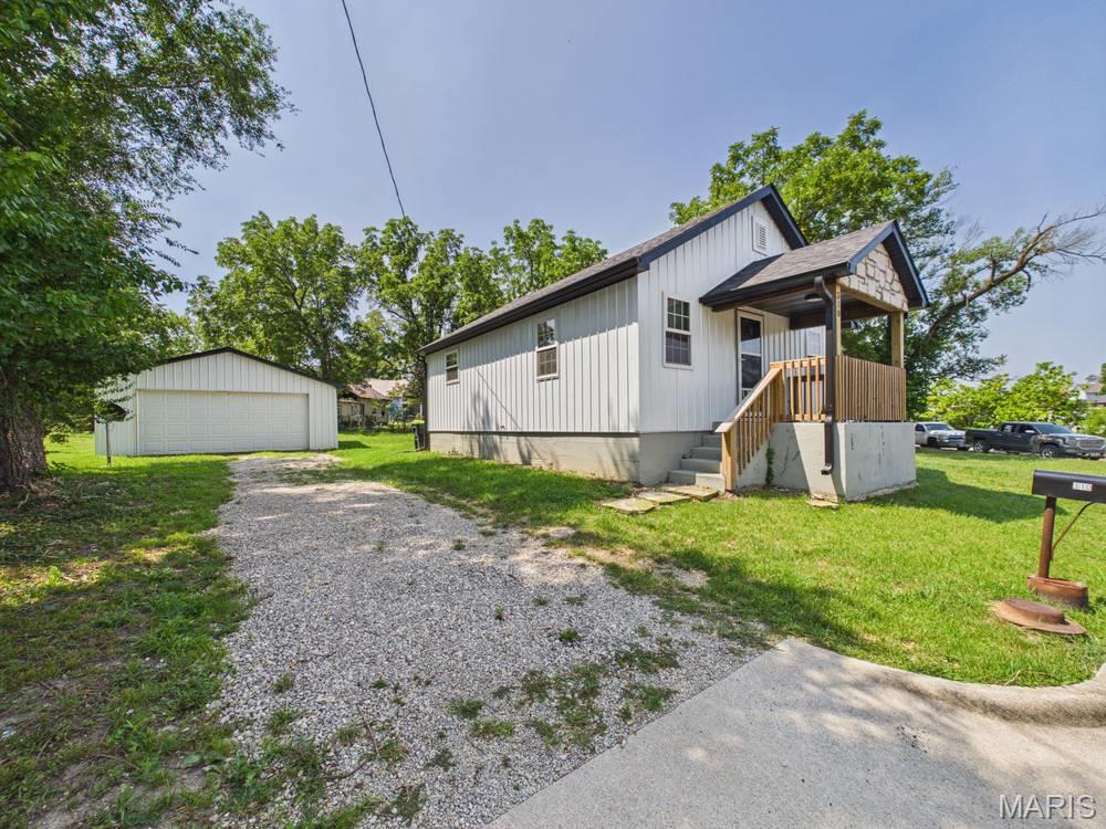 What a STUNNER!  Recently (2025) COMPLETELY remodeled down to the studs, this cozy lil charmer has got THE GOODS!  Stainless steel appliances, full open floor plan, vinyl plank flooring, centrally located bathroom, subway tile throughout- spacious kitchen with stainless farm sink, ample mud room off the back of the kitchen leading to the back door and a wide, full concrete stairwell leading to a well lit, spacious unfinished basement compliments the space above and gives you TONS of room for laundry and storage.  There’s an extra large two car garage AND additional storage shed so ample storage space inside AND out with this home option- Plus a double sized corner lot with private back yard perfect for grilling…. This is SOOO much more than a GREAT start, This place is already one of those places you wanna check in and never leave.  SOOO close to the downtown business district, you’ll have food truck AND farmers market options within smelling distance (two blocks away).  You’ll be centrally located to the grocery stores (seven blocks) post office (four blocks) and multiple convenience stores, city parks and more.  A quick commute to the Lake of the Ozarks OR Fort Leonard Wood, this place is truly a great location in town!  A large driveway and cozy, elevated front porch overlooking the freshly paved blacktop of North street completes this handsome lil home package, sellers are even throwing in the washer and dryer so schedule your showing as soon as possible before the new wears off ;)