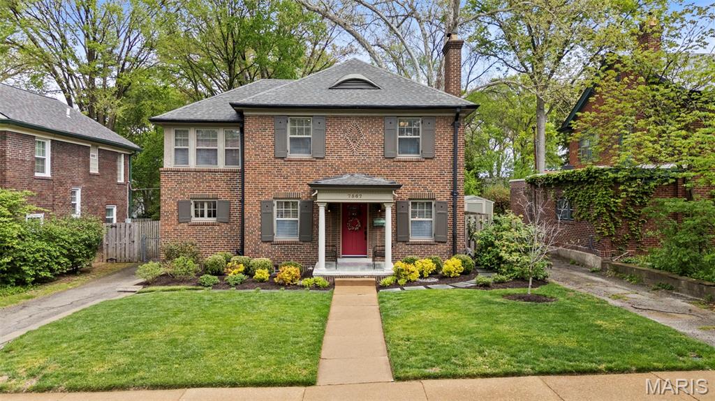 Picture perfect! With timeless style and lots of updates, this three-bedroom, 2.5 bath brick home boasts over 2100 square feet of total living space, plus a deep level lot in a highly sought-after University City neighborhood. The front yard’s professional landscaping and the attractive new front porch with handsome columns set the tone, warmly welcoming you to the home’s classic features, polished charm and modern enhancements. Inside, you’re greeted immediately by the beautiful hardwood floors, pleasing neutral palette and the home’s easy flow throughout. The oversized living room features an updated gas fireplace framed by custom bookshelves, windows and a new mantel. The dining room showcases two stained-glass windows and large picture windows overlooking the delightful, newly fenced backyard. Totally updated, the inviting kitchen spotlights new custom cabinets, countertops, lighting, refinished floors and new appliances. The adjoining, cozy breakfast room provides extra space, another peaceful vista of the backyard and opens to an enjoyable brick patio. Don’t miss the office/workout area in the attached converted garage space. Upstairs are three bedrooms with nice light and space, plus an updated hall bathroom. The primary bedroom opens easily to the cheerful sunroom, which adds good flow and versatility as an office/den with a large closet and storage space. The nicely finished lower-level provides great additional living space and features canned lights, a sophisticated stained concrete floor, an attractive full bath, and laundry. All this plus easy walking to neighborhood dining, shops and parks!