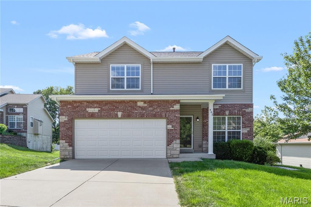 Welcome to 465 Fall River Lane! Tucked away on a quiet cul-de-sac street, this spacious 2-story home offers 4 bedrooms, 2.5 bathrooms and nearly 2,000 sq ft of living space. The main level features luxury vinyl plank flooring and an open-concept layout perfect for everyday living and entertaining. The kitchen features 42-inch white cabinetry, ample counter space and a walk-in pantry and flows seamlessly into the dining and living areas. A bay window fills the living space with an abundance of natural light, while a cozy gas fireplace adds warmth and charm. A half bath and convenient main-floor laundry with washer and dryer complete the main level. Upstairs, the spacious primary suite features a beautiful coffered ceiling, large walk-in closet and private en-suite bath with dual vanities, separate tub and shower. Three additional bedrooms offer generous closet space along with a second full bathroom. The lower level is unfinished with a walkout, rough-in for a bath and two egress windows, just waiting for your finishing touches. The walkout leads directly to a patio area overlooking the backyard, offering even more potential for indoor/outdoor living and entertaining. Step outside to the newer deck overlooking the park-like wooded backyard and common ground which is a wonderful setting for morning coffee, relaxing or entertaining family and friends. Additional highlights include a 1 yr old roof, 2 car garage, plenty of storage space, and a great location close to shopping, dining and highways within the Francis Howell School District. This one is ready and waiting for its next owner! Don't miss your opportunity to make it home!