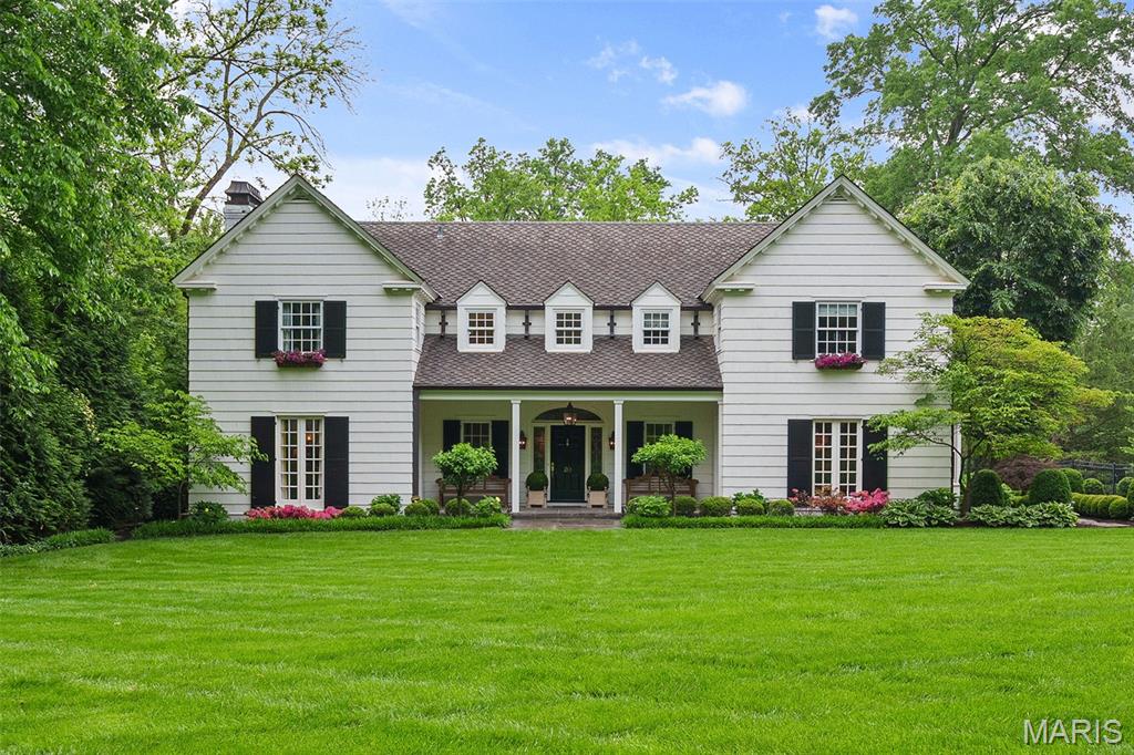 Multiple award-winning & published home blending historic charm w/ refined updates in sought after Ladue's Picardy Lane. Professionally landscaped exterior by Frisella features custom outdoor lighting, lg brick patio, speaker system, & bespoke firepit. Porte cochere & oversized 2 car garage w/ game room by Chouteau Building Group. Spacious first floor w/ new kitchen featuring walnut-accented cabinetry, Sub Zero 36" fridge & freezers, Wolf microwave & built-in coffee machine, Ilve range, & custom pantry. Two offices w/ 4 workstations, custom dog shower, generously sized formal living room, dining room and foyer complete the first floor. Luxurious primary suite features four custom wardrobes, rebuilt fireplace, walk-in closet w/ Stark carpet and LED-lit cabinetry. Primary bath w/ heated floors & towel bar, & Waterworks hardware. 2nd floor w/ 3 addtl bedrooms & 2 newly renovated baths. This completely updated, move-in ready home is a rare blend of craftsmanship, comfort, & curated design.