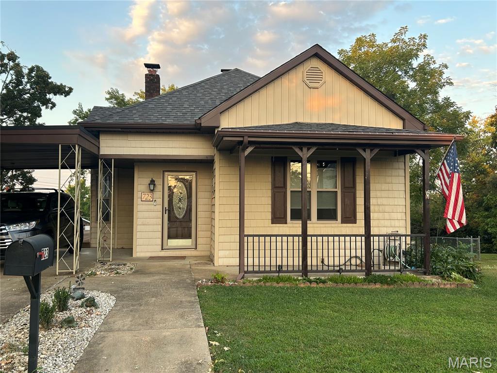 Don't miss out on this one in the heart of De Soto.  Ready to experience a truly move in ready home???? This is the house to stop the car, tuck and roll and race to be first in line to see this amazing property. Roof is 2 MONTHS OLD, newer water heater, and an updated electric panel. The house has been kept in meticulous condition.  As you enter thru the front door, you can see the original hardwood floors in the dining and living room.  The character of the home shows with an oversized pocket door for the living room to create some privacy on movie night. The dining room has a one-of-a-kind coffered ceiling that you just can't take your eyes off of.  Bathroom is very spacious and has an ONYX surround on the walls of shower, and Main Floor Laundry so there are no steps to tackle with a big laundry basket of clothes.  The electric panel has been updated and step out of the kitchen onto a private composite deck ready to BBQ or have the morning cup of coffee.  The property sits on 3 lots and comes with a detached shed to place your outdoor extras.  Amazing location, Awesome Price, and is just missing new owners looking to start making happy memories.  Don't hesitate or procrastinate on this listing!