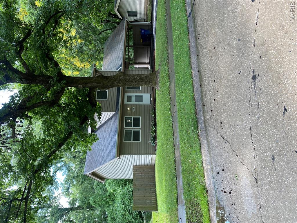 Welcome home to this charming slab home in a quiet, established neighborhood! This spacious two-level home offers comfort, convenience, and a versatile layout perfect for today's lifestyle.

The upper-level features three bedrooms with high-quality carpeting and a full bathroom. On the main level, you'll find an open floor plan with a second full bathroom, an updated kitchen with ceramic tile flooring, and all appliances included—gas stove, refrigerator, dishwasher, and built-in microwave.

The living room flows into a flexible family room, dining area, game room, or home office/technology space, all with durable luxury vinyl plank flooring. Sliding glass doors lead to your private deck, creating the perfect setting for barbecues, family gatherings, or simply enjoying your morning coffee or tea. The interior has been freshly painted, making this home truly move-in ready.

This home is ideal for first-time buyers or those looking to downsize, featuring a convenient no-step entrance for easy accessibility. The oversized backyard offers plenty of room for entertaining, outdoor activities, or even practicing your golf swing. A two-car covered carport provides additional convenience and protection from the elements.

For added peace of mind, the seller is offering an AP Home Warranty. Conveniently located near shopping, dining, schools, and major roadways. 

Don't miss this opportunity! Homes like this don't stay on the market long. Get pre-approved and schedule your private showing today!