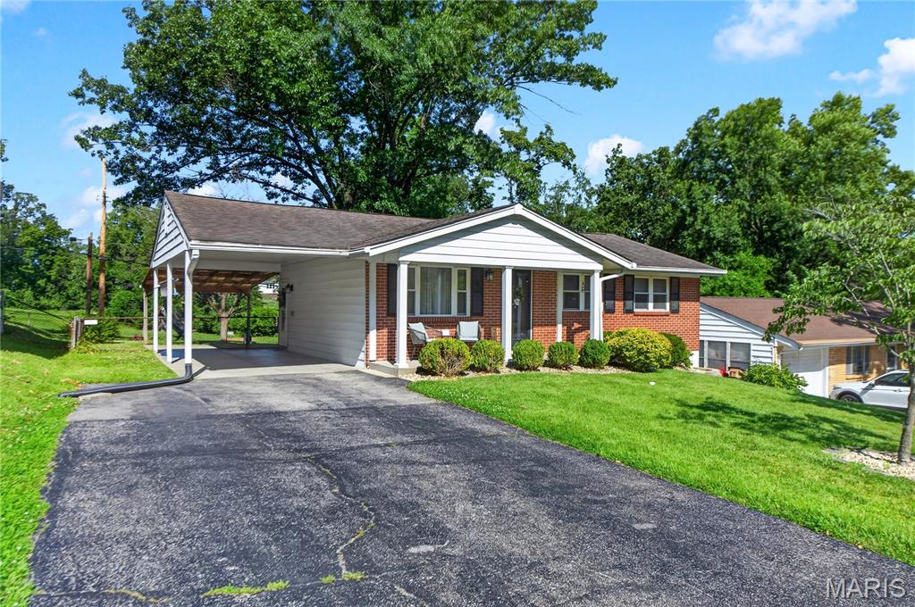 Affordable opportunities in the award-winning Rockwood School District are becoming increasingly difficult to find, and this Fenton ranch delivers exceptional value in a convenient location close to parks, restaurants, shopping, healthcare, and interstates.

The main level features a comfortable living room, an eat-in kitchen, three bedrooms, and a full hall bath. The finished lower level expands the home’s functionality with a spacious finished sleeping area featuring an egress window, walk-in closet, and adjacent full bath, along with an additional finished bonus space that can easily adapt to a variety of needs.

Outside, you’ll find a covered back patio, fully fenced backyard, an attached one-car carport, and an oversized driveway with plenty of additional parking.

Thoughtfully priced to allow the next owner an opportunity to personalize over time while building equity, this home presents an excellent opportunity to own in one of the area’s most sought-after school districts at an attractive price point.

If you’ve been searching for affordability, flexibility, and convenience in Fenton, this home deserves a spot on your list.