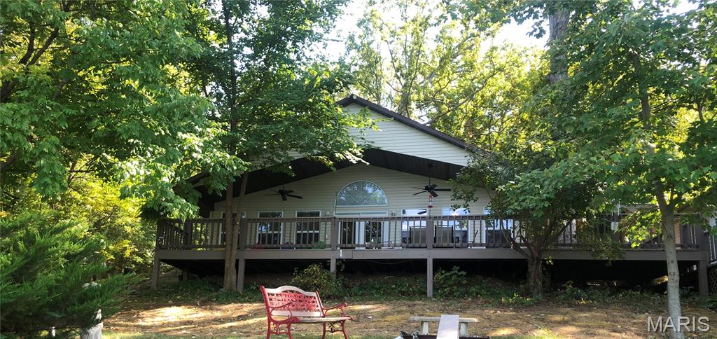 Lake life couldn't get any better than this!   Experience picturesque views of Crystal Lake, local wildlife, and birdwatching opportunities right at your doorstep!  Reconnect on 1.25 acres of nature in this beautiful 1 bd 2 ba lake home.  The open floor plans offer a sense of spaciousness, natural light, and connection.  This home has ample amount of outdoor entertaining spots:  decks, pergola, dock, detached living area (with heat & cooling system) , and another tiny home that can be turned into a cozy spot for guest or an office.  What a perfect home for a weekend get away, "Glamping", grandkids favorite memory or as your forever home  ..  set up an appt to see today!