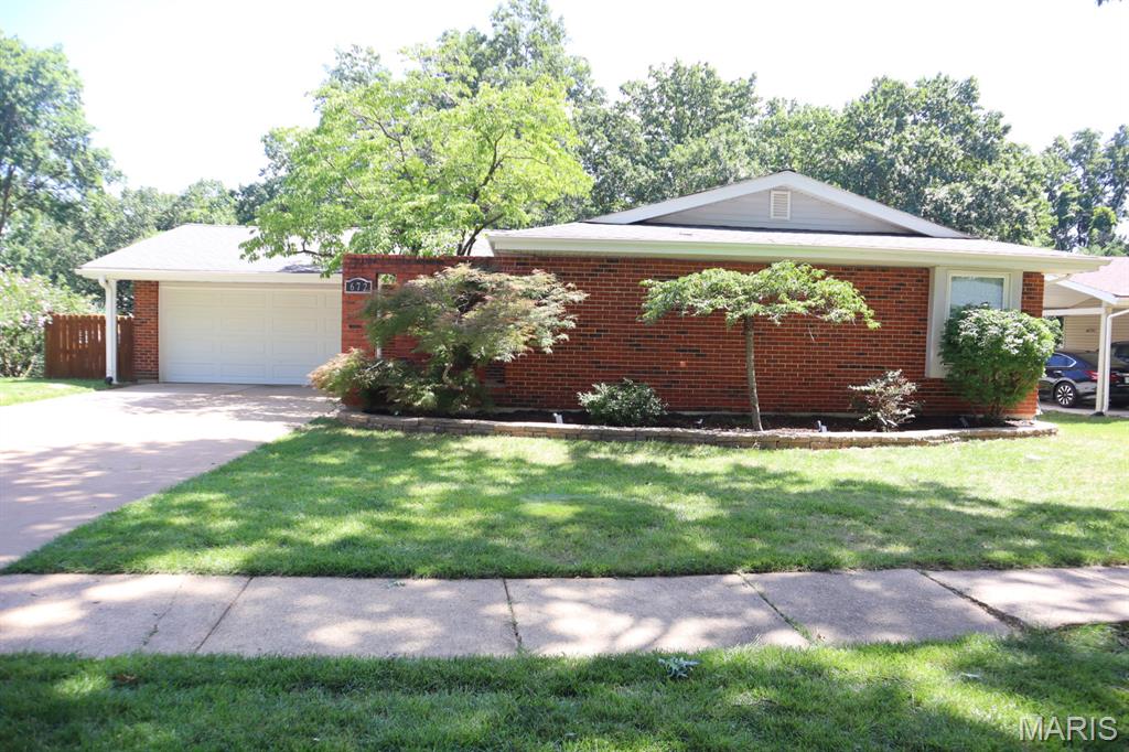 Beautifully maintained home in the highly sought after Rockwood School District! As you step inside, you're welcomed by updated hardwood floors throughout the main level. The kitchen features custom cabinetry, granite countertops and stainless-steel appliances.  The finished lower level offers a spacious family room with a walkout to the patio, an additional bedroom and a full bathroom adding additional living space. Outside you will find a large deck overlooking a multi-level yard that backs to common ground where you can relax, entertain or enjoy the view. This is a great home with all kinds of updates and features that you are looking for.