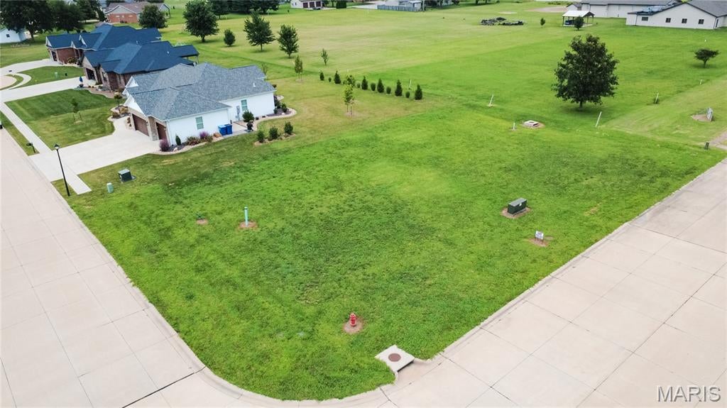 The biggest lot on the street. Same price as the rest of them.Some buyers walk a subdivision and just know which one is the good one. This is that lot, 17,860 square feet, the largest homesite currently available in Northtowne Estates, with the extra frontage and depth that let you set the house exactly where you want it instead of where the setbacks force it. Imagine the driveway you've been picturing, the side-entry garage that actually fits, and a backyard with room to breathe. Then imagine every one of those things costing you the same as the smaller lots down the block. Northtowne Estates is fully improved and ready for construction, with village water, sewer, and utilities at the street, concrete streets, sidewalks, and streetlights already in place. Recorded restrictions protect the neighborhood's standard, minimum living area, masonry fronts, architectural shingles, two-car garage minimum, no modular homes, in-ground pools only, no chain link. Additional lots on the street are available. Biggest lot, same price, everything already in the ground. That math doesn't last.