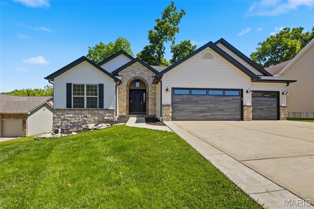 Welcome to 1128 Patsy Lane — a beautifully updated 4+ bedroom, 3-bath home offering space, comfort, and incredible functionality! From the moment you arrive, you’ll notice the impressive curb appeal with NEW SIDING, NEW GARAGE DOORS, NEW ROOF, and NEW GUTTERS already completed for peace of mind. Inside, the open floor plan creates a warm and inviting atmosphere perfect for everyday living and entertaining alike.   The spacious kitchen flows seamlessly into the main living area, while the finished walkout basement offers a full second kitchen — ideal for multi-generational living, entertaining guests, or creating the ultimate recreation space. Convenience abounds with main floor laundry plus an additional laundry hookup in the basement.
Step outside to enjoy the private backyard featuring a deck and wooded backdrop that provides a peaceful setting to relax and unwind. Additional updates throughout the home, including a BRAND NEW HVAC system!! make this property truly move-in ready.   Located close to shopping, dining, and everyday amenities, this home checks all the boxes — plus a spacious 3-car garage!!! Don’t miss your chance to own this incredible property — schedule your private showing today!