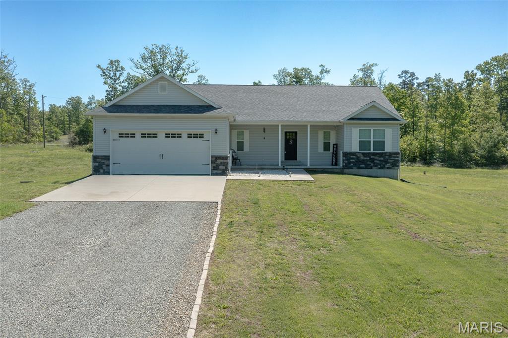If you are looking for a well maintained home, shop and room to roam, look no further! Built in 2019, this home features 1,559 sq. ft. on the main level and offers an inviting open kitchen, dining and living space, perfect for gathering. The master suite has a vaulted ceiling, double sinks, separate tub and shower and a closet large enough you'll likely have room to spare. Two additional bedrooms and an additional bath complete the main level. An open staircase leads to the basement which offers tons of additional space including two bedrooms, other rooms to use as you'd like and plumbing roughed in for an additional bath. The tasteful finishes throughout the interior of the home are matched by the curb appeal on the outside. Surrounded by open yard on all sides and backed by woods, this 12 acre parcel provides opportunities for a garden, play, entertaining and even a little hunting. In addition to the attached garage, the 30' x 50' 2-bay shop is located a short walk from the home and makes this property check all the boxes. Located just outside Fredericktown on a paved state highway, this home is one you'll want to see!