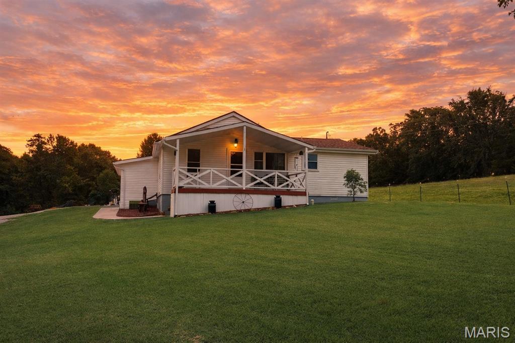 Experience the best of both worlds with this charming 3 bed, 2 bath country home, just a short drive to town and minutes to Hwy 44. Wide open park like spaces surround the property, offering privacy, fresh air and room for you animals to thrive. The land is fenced and cross-fenced, ready for horses, cattle or your favorite four-legged companions. Whether you're sipping coffee on the porch or tending to your animals at sunset, this property delivers the peaceful rural lifestyle you've been dreaming of-all without giving up quick access to shopping, entertainment and restaurants.