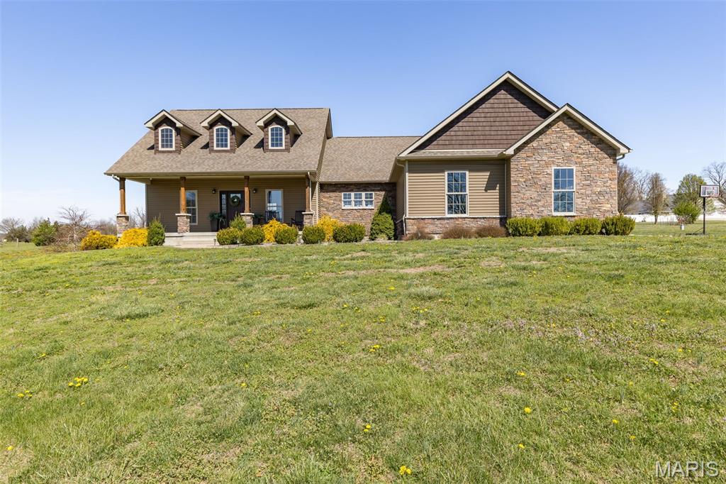 Welcome to your own private retreat just minutes from Farmington—where everyday living feels like a getaway. Set on nearly 5 acres, this stunning custom-built home offers over 4,000 finished square feet designed for both elevated living and effortless entertaining. From the moment you step inside, you’re greeted by soaring vaulted ceilings, rich hardwood floors, and a striking floor-to-ceiling stone fireplace that anchors the space with warmth and sophistication. The heart of the home is a beautifully designed kitchen featuring custom cabinetry, granite countertops, and a large center island—perfect for gathering with family or hosting unforgettable evenings with friends. The primary suite offers a peaceful escape with abundant natural light and a spa-like ensuite, while the finished lower level creates a home of its own—complete with a private suite, expansive living area, office, kitchen/bar space, and a secure safe room for added peace of mind. But what truly sets this property apart is the outdoor experience. Step outside to your own resort-style backyard, where a newer custom in-ground pool, expansive patio, hot tub, and pool house create the ultimate setting for summer days and sunset evenings. Whether you’re hosting poolside gatherings or enjoying a quiet morning coffee, this space was designed to be lived in and loved. And for those who need space beyond the home, the impressive 84x40 detached shop offers endless possibilities—from a dream workshop to additional storage or hobby space—complete with two finished rooms and its own bathroom. This is more than a home—it’s a lifestyle of space, privacy, and everyday luxury.
