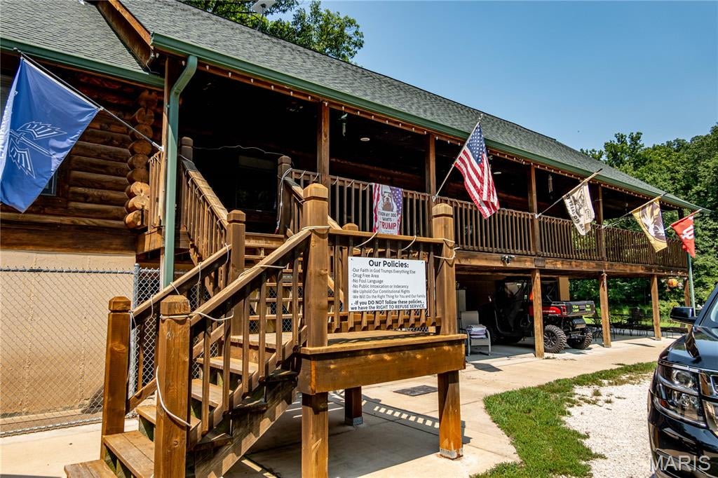 Your Private Nature Retreat Awaits
If you’ve been dreaming of owning your own private hobby farm, wooded retreat, or nature-filled paradise, this exceptional 25-acre property deserves a closer look. Tucked away behind a gated entrance, a picturesque quarter-mile paved drive winds through the woods and leads you to a charming log cabin-style home surrounded by nature and privacy.
The approximately 3,000-square-foot bi-level home features a welcoming wraparound porch and a peaceful setting that feels worlds away from the everyday. The upper level offers approximately 1,968 square feet with two bedrooms, 1½ baths, a spacious family room, and kitchen. The lower level is divided into two approximately 1,032-square-foot areas, including a finished space that could make an ideal mother-in-law suite, guest quarters, home office, or additional living area. The other area provides a convenient two-car garage.
Just south of the home, a substantial 30' x 40' three-sided metal-clad carport provides excellent space for vehicles, equipment, recreational toys, or other storage needs. Beyond the carport, you’ll find a pond and approximately half an acre of level, usable ground—offering even more possibilities for enjoying and utilizing the property.
The property is currently being used as both a residence and pet-care facility, demonstrating its versatility and potential for a variety of uses. Approximately two acres surrounding the home are fenced.
Numerous major improvements have been completed over the past ten years, giving the next owner a solid foundation to build upon. The septic system and pond have been renovated and brought up to code, the roof is approximately ten years old, and concrete pads have been added around the buildings. The private entrance and paved drive have also received significant improvements. Plumbing, electrical, and HVAC systems have been replaced or upgraded.
Whether you envision a hobby farm, private homestead, business opportunity, family compound, or simply a secluded place to escape and enjoy the outdoors, this property offers the space, privacy, and infrastructure to make that vision a reality. The hard work is already underway—now it’s ready for its next owner to make it their own.
Come experience the privacy, possibilities, and natural beauty for yourself. Your own piece of paradise may be closer than you think!