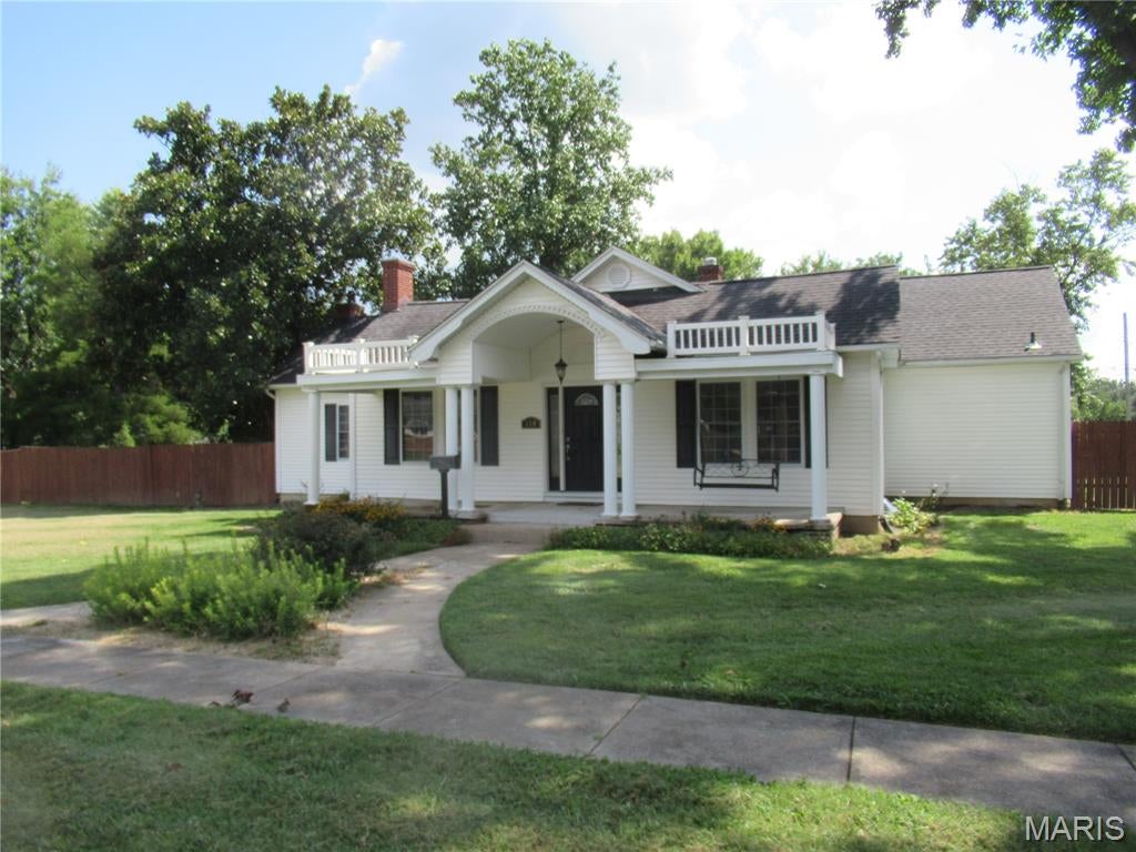 H2262 TURN OF THE CENTURY HOME on 1/2 acre lot with privacy fence in the heart of Sullivan. Spacious 2137 SF home with 9' ceilings. Dry Basement with 3rd full bath. Covered front porch. Single car garage and double car carport. The interior has many special features. Two large arched doorways. Gas fireplaces in both the formal dining room and the great room. Great room has beamed ceiling, built-in shelving and atrium door to the large, covered back patio. Breakfast area. Large granite island work area. Kitchen includes all appliances and Corian countertops. 20x13 Master bedroom with sitting area. Remodeled master bath and walk-in closet. Laundry room includes the LG Combo Washer/Dryer All-in-One unit. Second bath includes separate shower and tub. 2nd bedroom is 13x13. The yard is beautiful and ready for lots of family fun.