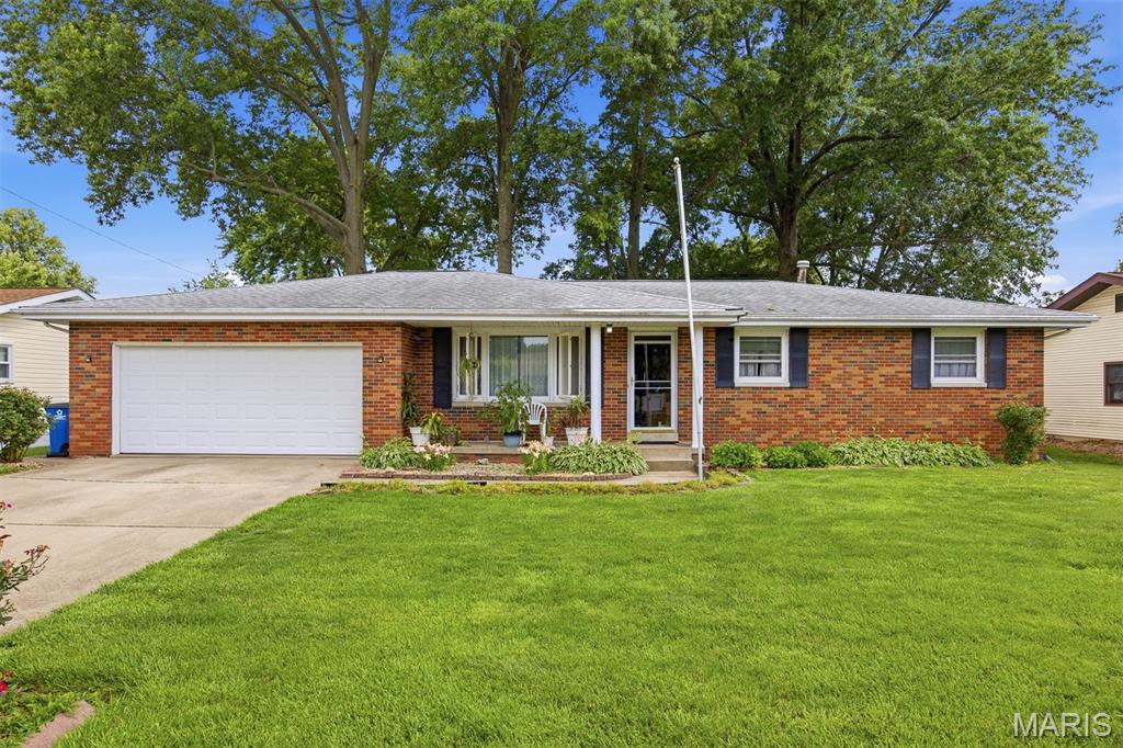 Check this one out!  Charming Brick Ranch home conveniently located to all Amenities!  This BEAUTY features a Large Living Room, Spacious Eat-In Kitchen with Breakfast Bar, SS Gas Stove and Refrigerator and plenty of cabinets (Pantry closet).  Relax in the Four-Season Sunroom complete with Free Standing Gas Fireplace and an Awesome View!  Three bedrooms and Full Hall Bath (Pocket Door for Separation to the Water Closet/Shower) complete the main floor living area.  Full, unfinished basement includes a second "non-conforming" bathroom with Toilet/Sink/Concrete Shower, Laundry Area, Dedicated Storage Closet and a wonderful opportunity to increase the overall living space of the home!  Enjoy the large backyard shaded by mature trees, alley access and a 2-Car Attached Garage!  Estate Sale.  Seller to Make no Repairs.  Roof and guttering to be replaced prior to closing. HVAC & H/W within last 5 years.