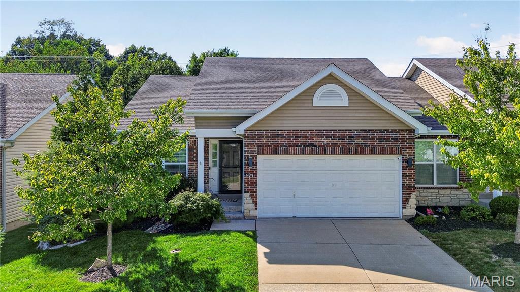 Welcome to this extensively upgraded villa in the sought-after Villas of Southwoods. This move-in-ready home has been thoughtfully enhanced with high-quality finishes and improvements throughout. The remodeled kitchen serves as the centerpiece of the home, featuring an upgraded gas range that brings both performance and style to everyday cooking and entertaining. Hardwood flooring in the dining area complements the updated space, while the fully renovated lower level adds polished, flexible living space. The lower-level primary suite offers a private retreat, complete with a custom-designed closet, and is highlighted by a luxurious en suite bathroom with a spa-like feel and heated floor. The impressive double walk-in shower features a rain showerhead alongside a detachable handheld option, plus dual wall-mounted body jets and a built-in bench on both sides-a true spa experience at home. On the main level, the light and bright bedroom features new carpet and close proximity to the full bath. The open living room creates an inviting setting for everyday living and entertaining, anchored by a natural gas fireplace that adds warmth and character. The laundry and utility space has also been upgraded with added storage, providing practical organization and functionality. Outdoor living has been elevated with an added rear patio, professionally enhanced landscaping, and a custom stone grill area designed for effortless entertaining. This dedicated outdoor space creates the perfect setting for grilling, gathering with friends, or enjoying relaxed evenings at home. This upgraded villa offers the convenience of maintenance-friendly living without sacrificing style, comfort, or finished space.