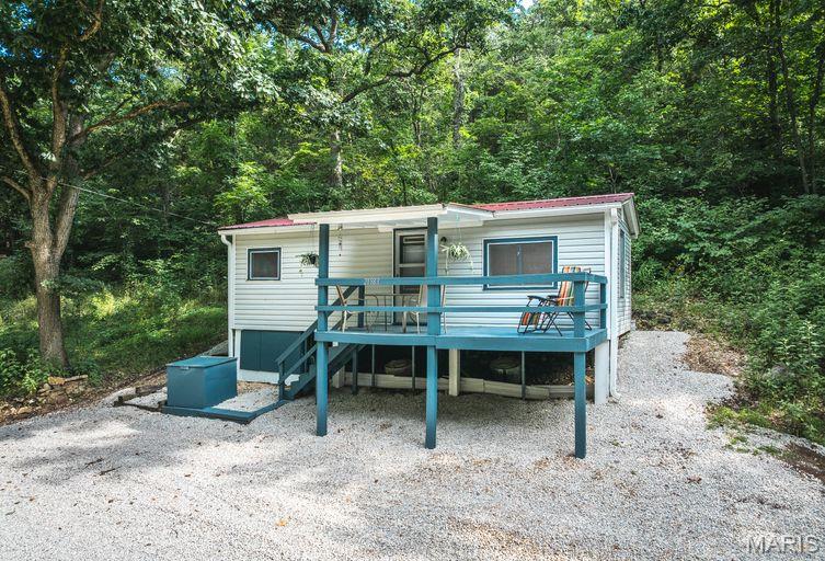 Looking for the perfect weekend getaway? This adorable cabin in a private gated community on the beautiful Gasconade River could be yours! River access is just a  a short walk down the shaded lane. Boaters and kayakers, Sport Haven Subdivion offers a PRIVATE boat ramp for owners only! The Cabin's interior boasts many interior updates. The open floor plan has all the amenities for that comfy retreat you've been looking for. From the covered front deck, walk right into the spacious open living space complete with a full bath and kitchen with electric range. There is a small covered back patio directly off the kitchen perfect for grilling and fish frying after a day on the water. This one is any angler's/nature enthusiat's dream.  The adjoining vacant lot is owned by the seller and could be purchased for additional privacy.