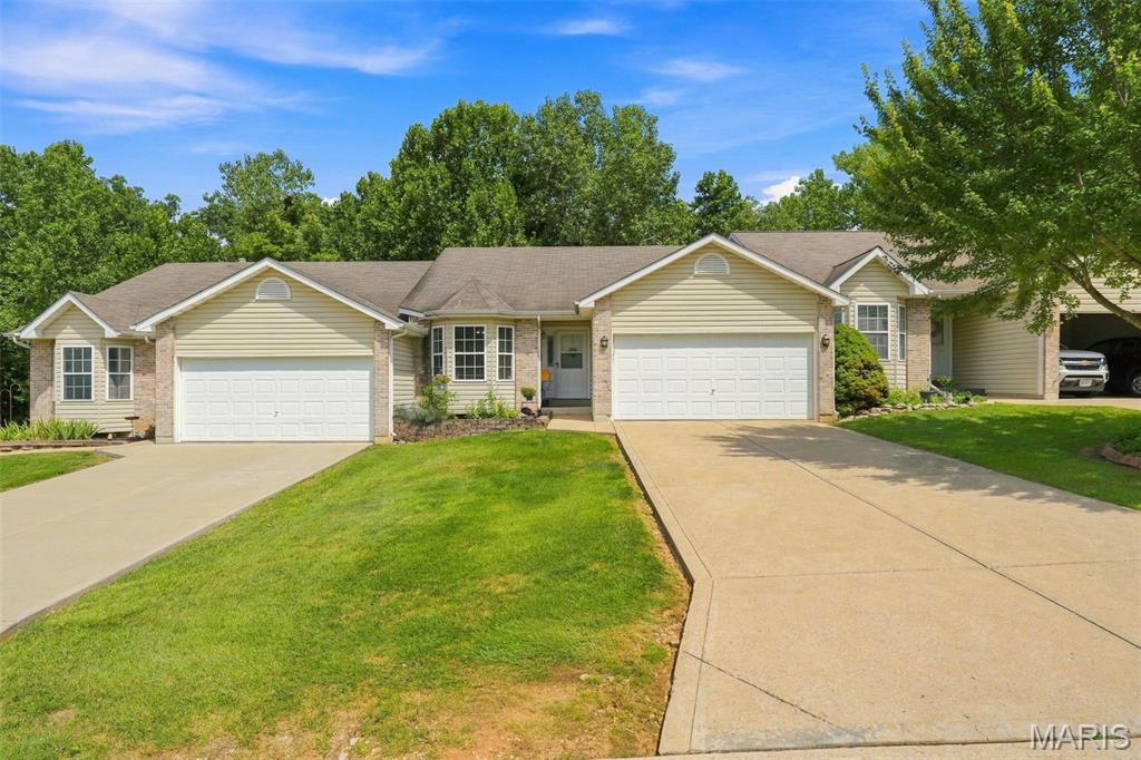 Welcome to this beautiful 2-bedroom, 3-full-bath ranch villa with over 1830 sq ft of living space. The 1,180-square-foot main level features newer luxury vinyl plank flooring, an open concept living room, vaulted ceilings, a gas fireplace, main-floor laundry and a comfortable four-season room adjoining the kitchen. The primary suite includes a full bathroom and a spacious walk-in closet. The full basement—a feature not found in every home in the community— is a walk-out and provides exceptional additional space. With full-size egress windows, ample natural light, a full bathroom, closet and large storage area. The lower level could easily accommodate a recreation room, additional living area, guest sleeping space, or a future third-bedroom suite. A 2-car garage and additional off-street parking complete the property. Fees include lawn care, snow removal, and trash removal. This spacious ranch home is tucked back in a beautiful community and is located near the cul-de-sac. The home backs to trees, and offers a private setting with beautiful, wooded views.   Welcome home.