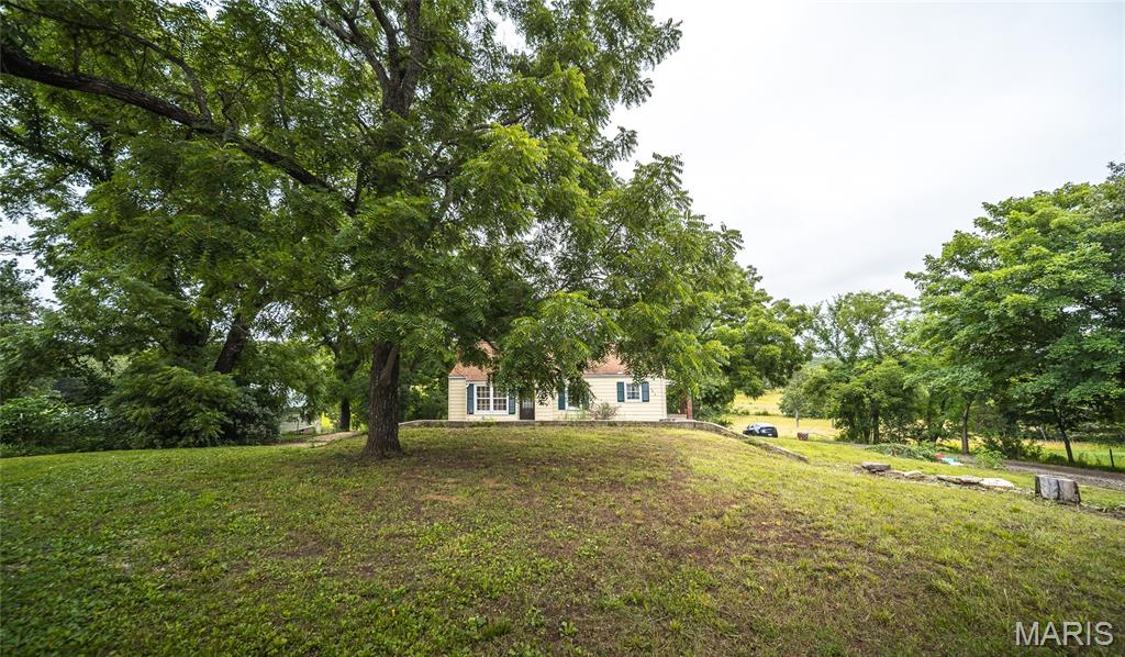 Enjoy the perfect blend of peaceful country living and convenient access to town with this charming 3-bedroom, 2-bath home located just north of Rolla. Nestled in a serene rural setting, this property offers the tranquility you've been searching for while remaining just minutes from shopping, dining, and everyday conveniences.

Step inside and feel right at home with beautiful hardwood flooring that flows throughout the main living areas, creating a warm and inviting atmosphere. The thoughtfully designed layout offers comfortable living spaces filled with natural light, making it easy to relax, entertain, and create lasting memories. The kitchen features stainless steel appliances and plenty of space to prepare meals while staying connected to family and guests.

Downstairs, the partially finished basement provides valuable additional living space with endless possibilities. Whether you're dreaming of a family room, home office, workout area, hobby space, or guest accommodations, this flexible area can easily adapt to your needs.

Outside, enjoy the peaceful surroundings and scenic country views that make this property truly special. With room to unwind and enjoy nature, you'll appreciate the slower pace and privacy this location provides.

If you're looking for a home that combines comfort, character, and a desirable country setting near Rolla, this is one you won't want to miss. Schedule your private showing today and discover all it has to offer!