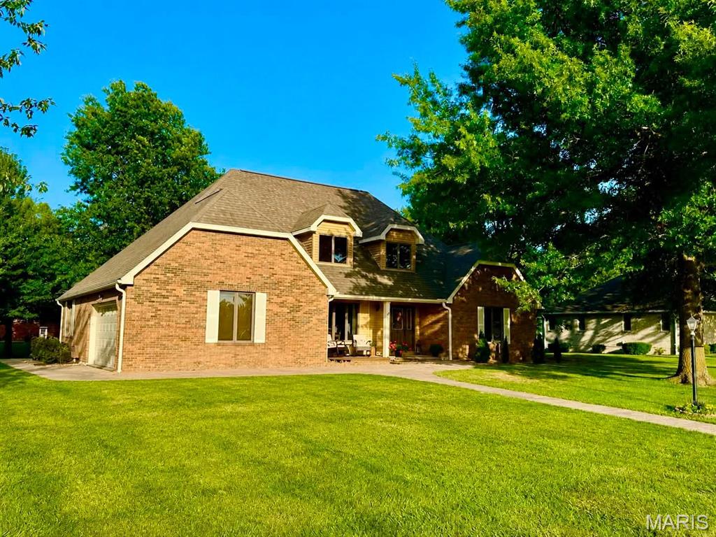 Welcome to one of Monroe City's most beautiful homes located on the outskirts of town & nestled on a large corner lot! As soon as you walk in the door you are greeted by a formal dining room to your left & massive living room displaying tall ceilings, focal point wood-burning fireplace, & views of the well-manicured back lawn beyond the deck. After leaving the living room stunned, next is the kitchen of your dreams with a massive island, granite countertops, & more cabinet/countertop space than you can even dream of utilizing! Even with ample area to entertain, this forever home also gives plenty of seclusion including: a large primary bedroom suite with a full bathroom ensuite, 2 additional bedrooms in the upper level with a Jack & Jill bath, full basement complete with a family room, storage, plus an additional 4th non-conforming bedroom. If you can think it, this home has it! Schedule a showing & see all it has to offer yourself!