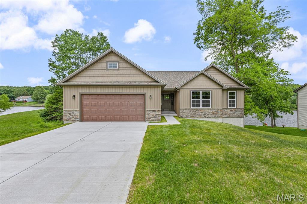 GORGEOUS WATERFRONT HOME!  Brand new ranch style home in desirable Raintree Plantation.  Spacious kitchen is at the heart of the home with stylish white cabinets, large center island, pendant lighting, pantry and stainless appliances.  Divided bedroom floorplan design is ideal for extra privacy.  Primary bed and bath have a luxury appeal with soaking tub, his and her vanities and walk-in closet.  Other bedrooms boast plush carpet, neutral paint palet and have exceptional room dimension.  Main floor laundry is strategically located near the bedrooms.  Full walkout basement with additional windows where you can admire the view of the water.  Mudroom is sure to impress with the built-in organizer complete with coat hooks and shoe cubbies.  And all the extras include:  panel doors, extended base trim, luxury vinyl floor throughout, ceiling fan/light, full bath rough-in, vertical siding and vinyl shake style siding detail.  Fully finished, oversized attached garage with opener.  And enjoy the stunning view of the lake from the covered porch or the covered patio.  The Raintree Plantation neighborhood is a gated community home to lakes, beach, golfcourse, clubhouse, pool and pickball courts.  You have found your own piece of paradise right here at 10532 Acorn Drive.  CALL TODAY TO TAKE A LOOK INSIDE THIS GREAT HOME BUILT BY LAIBEN HOMES.