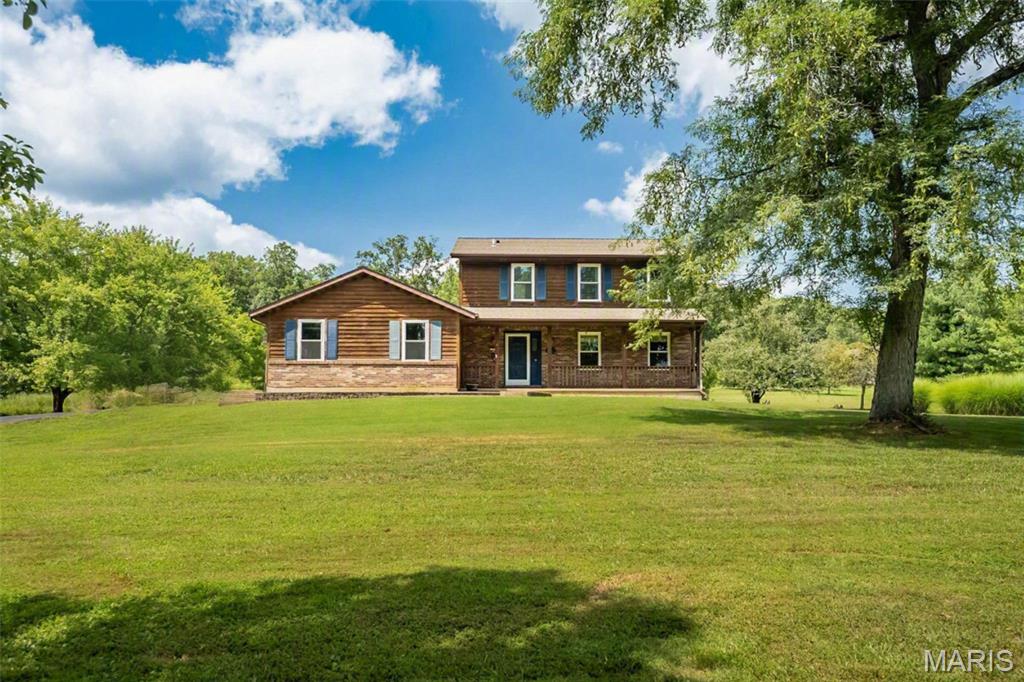 Welcome home to this hidden gem nestled on 2.3 secluded acres in the desirable Byrneshire subdivision! Escape the hustle and bustle while enjoying peaceful surroundings, beautiful scenery, and abundant wildlife. This beautiful two-story home offers 3 bedrooms, 2.5 baths, approximately 2,200 square feet of living space, and $50,000 in recent improvements. The welcoming exterior features a cozy covered front porch, architectural shingle roof (2019), enclosed soffit and fascia, oversized side-entry 2-car garage, and 16x20 storage shed.  
Step inside to an inviting, freshly painted open floor plan featuring a separate dining room highlighted by crown molding, chair rail molding, and beautiful hardwood flooring; a versatile sunroom/office with glass French doors leading to the deck; a remodeled half bath (2025); newer windows (2024); Plus, main-floor laundry.  Stylish, country kitchen offers a center island, ceramic tile flooring, abundant cabinetry, newer stainless-steel appliances (2025), and an adjoining breakfast area with glass French doors opening to the impressive 12x30 cedar deck. Great Room also shares the spotlight, showcasing vaulted ceilings, a wood-burning fireplace, recessed lighting, a bay window, and distinctive Barnwood flooring.  Upstairs features fresh paint, NEW carpet throughout the hallway and all three bedrooms, plus impressive 9-foot ceilings. The spacious primary suite includes a walk-in closet and an updated full bath with ceramic tile walls and flooring, plus a relaxing jetted tub. Two additional bedrooms and another full bath provide comfortable accommodations, including a Safe Step walk-in shower with a bench seat and transferable lifetime warranty (2022).  The lower level awaits your finishing touches and provides abundant storage, a 200-amp electrical panel, saltwater softener, two sump pumps, and dual-zone Lennox heating and cooling.  Step outside and embrace relaxation and serenity amid peaceful wooded surroundings, with plenty of space for outdoor enjoyment—all complemented by the countryside charm that welcomes you home every day. Truly one of a kind!
