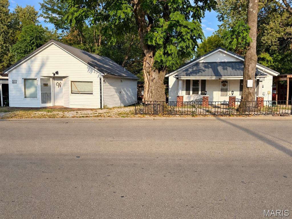 Unique investment opportunity with multiple possibilities. 

466 Lincoln includes two separate structures on a good-sized city lot in Lebanon. The main home offers a 2-bedroom, 1-bath layout, while the second structure provides additional space that could potentially be renovated for separate living quarters or reworked into a detached garage, shop or storage space. The property does need renovation, but some significant exterior improvements are already in place, including newer metal roofs, vinyl siding and windows. Additional outbuildings provide even more storage and flexibility. With multiple structures and several possible uses, this is a property that gives the next owner options depending on their plans. Whether you're looking for an investment project, additional living space, or room for a shop and storage, there is plenty here to work with. Property is being sold in its current condition. 

Buyer to verify all measurements, condition, zoning, permitting and intended uses.