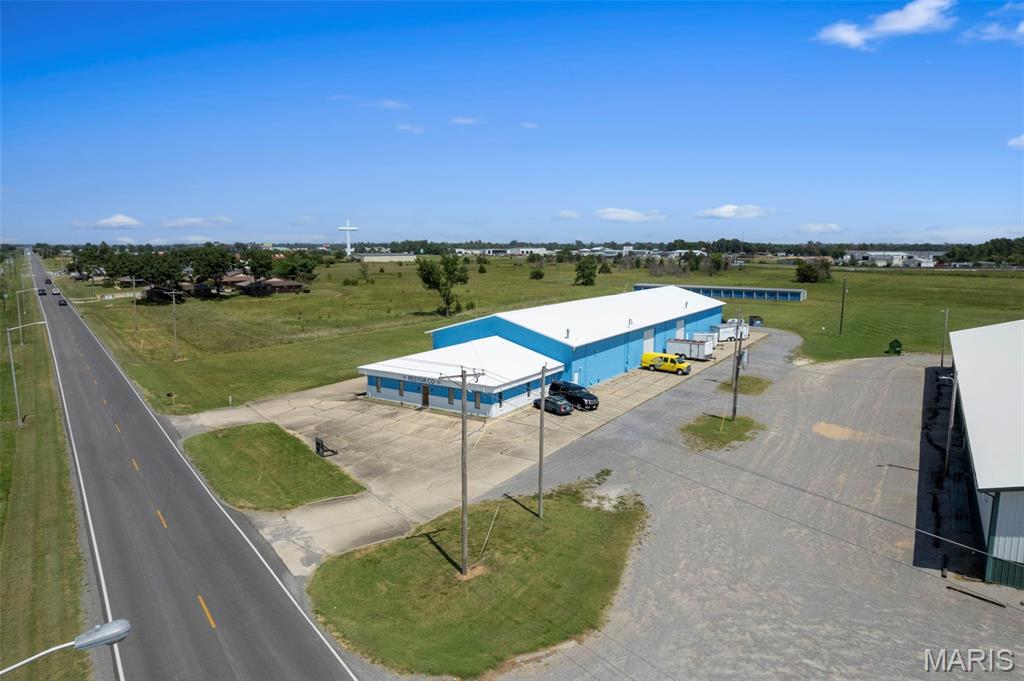 Versatile Commercial Warehouse & Investment Opportunity! This impressive 17,000 sq. ft. all-metal building sits on approximately 3 acres and offers a great combination of warehouse, office, and income-producing space. The property features approximately 12,000 sq. ft. of insulated warehouse space and 5,000 sq. ft. of office space, including 7 offices, a kitchen, and 4 bathrooms.
The warehouse is equipped with 3-phase electrical, floor drains, newer HVAC and water heater, and four 14-foot bay doors, providing excellent functionality for a variety of business uses. The property also includes 42 storage units in the rear, currently vacant and offering an excellent opportunity to generate additional passive rental income. Conveniently located near the interstate, this property provides easy access for employees, customers, deliveries, and transportation. A rare opportunity for an owner-user, investor, or business looking for space with built-in income potential!