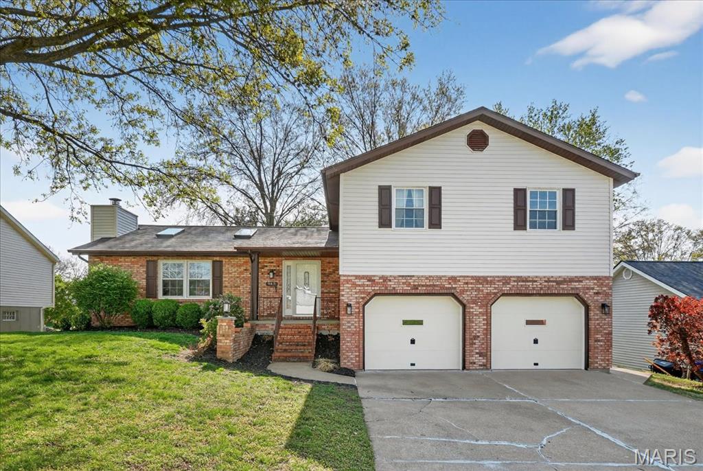 The one you have been waiting for!  This incredible 4Bed/3Bath has so many updates it will feel like you are walking into a new home! Inviting foyer entry w/leaded glass Pella entry door & storm door, opens to the family room features brick wood burning floor to ceiling brick fireplace, vaulted ceiling, 2 NEW skylights & double window that provides lots of natural lighting.  Make your way to the Stunning NEW eat-in kitchen with loads of 42" Custom Cabinets w/crown molding, granite counters, tile backsplash, breakfast bar, coffee/beverage center with more cabinets, stainless appliances, recessed lighting & Pella French Door leading to the ALL NEW, maintenance free multiple level deck & fenced in backyard! Make your way to the upper level to the Huge Primary suite w/Pella French Door to deck, nicely updated Full bath w/double vanity, ceramic floor & walk-in closet and down the hall you will find 3 additional nice sized bedrooms and full bath w/new fixtures!  Next, down a few stairs is the cozy family room w/doors leading to the deck, guest bath, laundry area and access to oversized 2 car garage w/utility sink & water spigot.  And just when you think you have seen it all you will find the huge unfinished space with plenty of room for all your storage needs!  This home also features Central Vac!  Other notable updates include: Roof, Siding, Exterior Lights- 2025, Custom blinds- 2022, Windows- 2010. Ask for the FULL list of features & updates including a NEW DRIVEWAY coming soon!