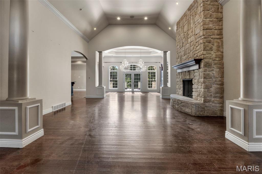 Welcome to 425 Windwood Lake Drive ! An extraordinary executive estate where every detail has been thoughtfully curated for those who refuse to compromise. From the moment you step inside, the soaring ceilings, ornate millwork, gleaming dark hardwood floors, and dramatic floor-to-ceiling stone fireplace flanked by classical columns announce that this is something truly special. Crystal chandeliers cast a warm glow over the sun-drenched great room, where French doors open to a private terrace and lush tree views. The chef's kitchen is nothing short of breathtaking  with  a massive custom island with hand-carved corbels, a statement copper range hood, professional-grade 6-burner gas range, dual dishwashers, double wall ovens, granite countertops, and a convenient butler's pantry/office just steps away. A dramatic powder room with glass vessel sinks, mirrored ceiling, and lacquered walls is a work of art in itself. Artisan ironwork gates guard the private wing, where the primary suite reigns supreme with its own foyer, a second fireplace with built-in cabinetry, and a jaw-dropping closet suite with floor-to-ceiling custom cabinetry, a center island with marble top, and a dedicated closet laundry. The spa-caliber primary bath stuns with dual floating vanities, quartz countertops, a freestanding soaking tub, and a separate walk-in shower beneath an arched window. Downstairs, the lower level is pure entertainment gold featuring a dedicated theatre room with space for a  built-in screen and custom cabinetry, a second full kitchen and bar, an exercise room, hobby space, and a cozy fireplace gathering area. Step outside to your own private resort: a covered pavilion with outdoor kitchen and bar, an in-ground pool, hot tub, and a fully fenced backyard that backs to serene woods. Two garages accommodate four cars plus a golf cart. Over 7,800 square feet of curated living space — this is not just a home. This is Paradise.

MUST HAVE A CONFIRMED SHOWING. Please no drive by or walking the property without scheduled appointment. “Property sold "As-is". Buyer and/or buyer's agent responsible for verifying all pertinent information deemed relevant by the prospective buyer, including but not limited to square footage, acreage, utilities, taxes, zoning, permitting, condition, school zones, HOAs, etc. Buyer must submit Letter Of Intent as the initial offer process, see in MLS Attachments.