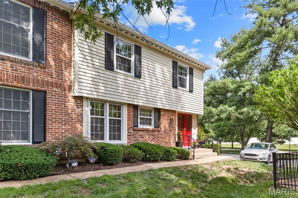 Welcome to 13336 Bragstadt Drive, an exceptional end-unit townhome in the desirable Wood Lake community. Offering a rare combination of value, spacious living, upscale finishes, and an unbeatable location, this home delivers a lifestyle that is difficult to match at an unforgettable price. An extensive list of renovations and upgrades has been completed, creating a move-in-ready residence that blends comfort, style, and peace of mind. Inside, you'll immediately notice the bright and inviting interiors. The updated kitchen features white upscale cabinetry, quartz countertops, stainless steel appliances, updated lighting, and a sunny breakfast nook framed by large windows overlooking manicured green space. The main level also includes a private office with built-in shelving and an expansive living and dining area with sliding glass doors that open to the patio, creating a seamless indoor-outdoor living experience. Upstairs, the spacious primary suite features a newly renovated bath with double vanities and designer finishes. Two additional bedrooms and a second full bath complete the upper level. The finished lower level offers exceptional flexibility with a built-in bar and sink, custom shelving, a laundry area, and storage space. Outside, the beautifully landscaped and fully fenced courtyard creates a private retreat for relaxing or entertaining. With one of the most attractive patios in the development, the home enjoys two private parking spots (one in the shared garage, one behind the patio), plentiful guest parking in the adjacent lot and a park and playground directly across the street. Wood Lake residents enjoy access to a clubhouse, pool, tennis courts, and lake, along with a strong sense of community. The location offers outstanding convenience with quick access to major highways, premier shopping, dining, parks, healthcare facilities, and top-rated Parkway schools. Recent improvements include a new HVAC system, water heater, fully renovated kitchen, new windows, main and lower level carpeting, fencing, updated bathrooms, six-panel doors, new lighting, ceiling fans, stair railing, window treatments, and complete aluminum wiring remediation.