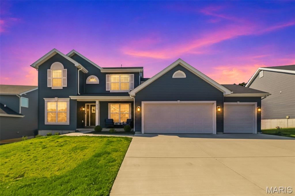 STUNNING 3 years new - 4 bed/2.5 bath two story home with a 3 car garage in Arbors of Rockwood in the highly rated Rockwood School District!  The main level has a wonderful open floor plan where the Great Room, Breakfast area, Kitchen, and Coffee Bar all flow into each other.  There is a separate Dining Room, Office/Living Room, half bath and main floor Laundry Room.  It is full of natural light and perfect for family living and entertaining. The upstairs has 4 bedrooms and 2 full baths.  The Primary Bedroom suite is spacious with a large walk-in closet and beautiful view of the wooded backyard.  The Primary Bathroom has 2 sinks, a separate shower and corner tub.  All 4 bedrooms have ceiling fans.  Everything is 3 years new in this lovely home and has the added features of a 3 Car Garage, Dual Zoned HVAC, cozy Fireplace, Walkout lower level and backing to beautifully wooded and treed common ground!  Room measurements were taken from the floor plans provided by the photographer and are not exact dimensions.  This home is BEAUTIFUL and MOVE IN READY!!!