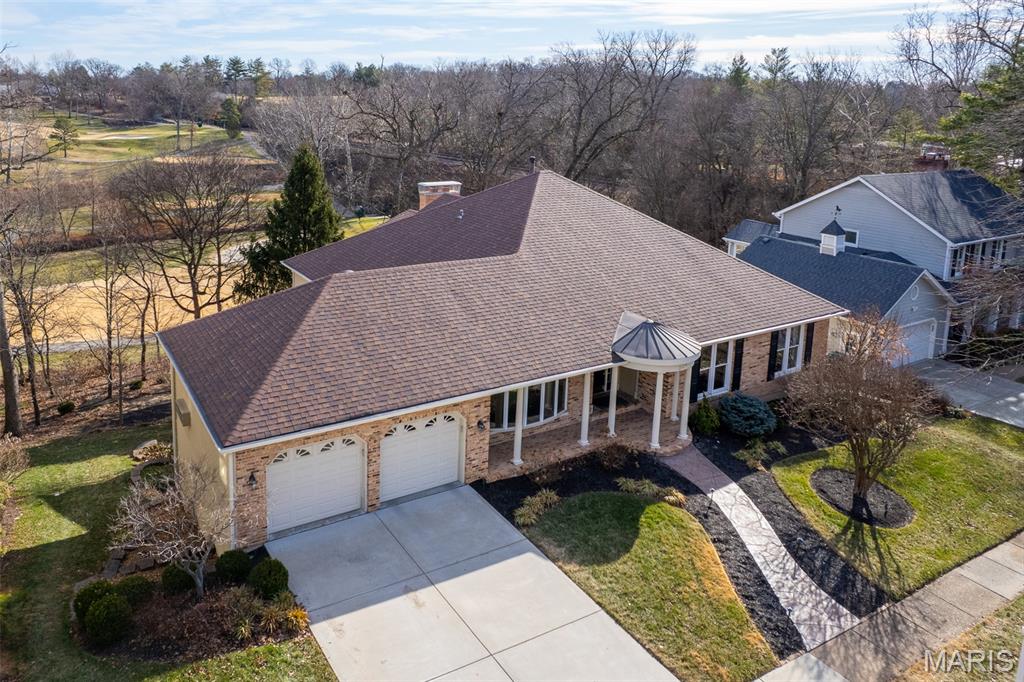 Nestled in the heart of the sought-after Greenbriar Estates subdivision, with Hole 4 of Greenbriar Country Club as the backdrop, this 4-bedroom, 3.5-bath home offers an exceptional combination of setting, luxury, and timeless appeal.

Upon entry, a grand living room with exposed beams and a striking fireplace immediately captures attention, setting the tone for the home’s character and warmth. A spacious office and formal dining room flank the entrance, providing elegant and functional spaces for both work and entertaining. A wet bar seamlessly connects the living room to the kitchen, which features a generous center island with cooktop and an inviting seating area overlooking the golf course—flooded with natural light and offering picturesque views.

A large laundry room with gas hookup serves as an ideal transition between the garage and kitchen, enhancing everyday convenience. Three bedrooms are located on the main level, along with two full baths and a half bath. The primary suite is a peaceful retreat, highlighted by large windows overlooking the course, a newly updated ensuite bath, and a walk-in closet.

The finished lower level expands the living space significantly, offering an additional bedroom and full bath, a large living area with a wood-burning fireplace, an entertainment room complete with wet bar and pool table, and a newly constructed theater room. Ample storage and space for a workshop add even more versatility.

Outdoor living is equally impressive, with an expansive covered and screened deck that opens to a beautifully maintained backyard gently sloping down to the golf course. Additional features include dual HVAC systems, a security system, self-dimming lighting throughout most of the home, and fresh finishes and paint throughout.

With serene golf course views, abundant living space, and an unbeatable location, this beautiful Des Peres home offers a rare opportunity to enjoy privacy, comfort, and the lifestyle that Greenbriar Estates is known for.