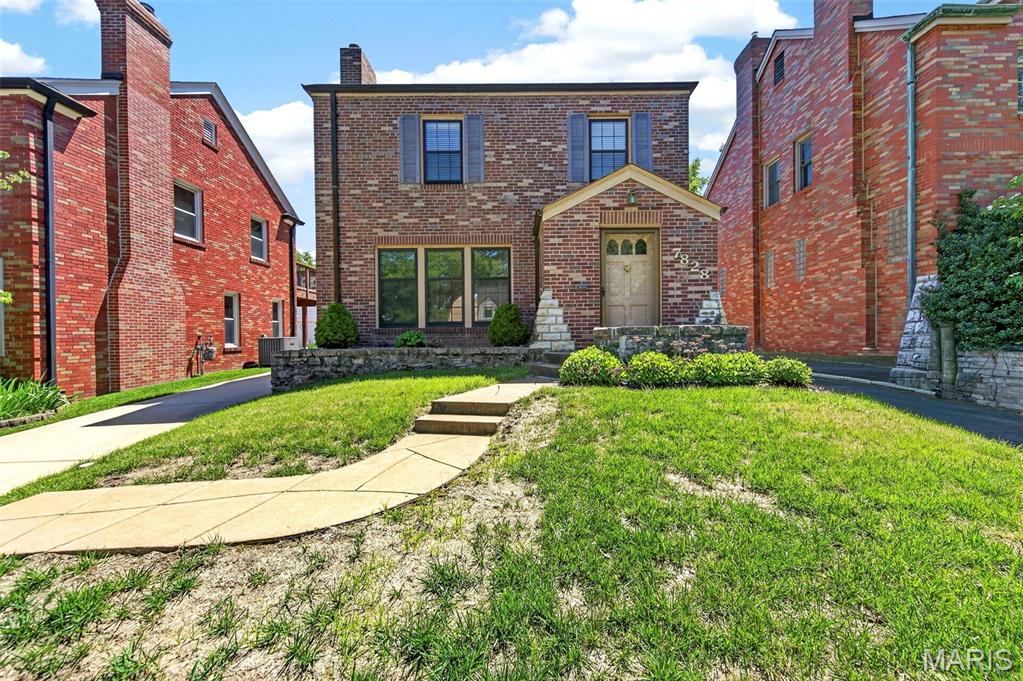 Set on a beautiful street right in the heart of University City is this stunning full brick two-story home with great curb appeal. As you enter, there is a coat closet and a half bathroom off the entry foyer. You will notice the wonderful hardwood flooring, the huge family room with a stone woodburning fireplace, and the nine-foot ceilings on the main level. Large dining room with hardwood floors and a huge arched window. Very nice kitchen with custom maple cabinets, granite countertops, stainless steel appliances, and ceramic tile flooring.

In the back, there is an extra living room addition with lots of windows. Going upstairs, you will love the partially spiral staircase with built-in plant shelves in the walls. Upstairs you will find a good-sized primary bedroom with a huge primary bathroom featuring a skylight, separate jetted tub and shower, and a large 11 x 6 walk-in closet that were both added above the extra living room. Two other good-sized bedrooms with hardwood floors and a large full hall bathroom complete the upper level.

Long newer concrete driveway for extra parking that leads back to an 18 x 11 one-car garage. As you go back, you will notice the large 16 x 10 paver stone patio and side door leading into the back living room. Furnace is approximately 3 years old, air conditioning is approximately 10 years old, roof is approximately 11 years old, and hot water heater is approximately 5 years old.

This home is priced to sell in as-is condition. Just look at the recent comparable sales near this home and you will appreciate the value.